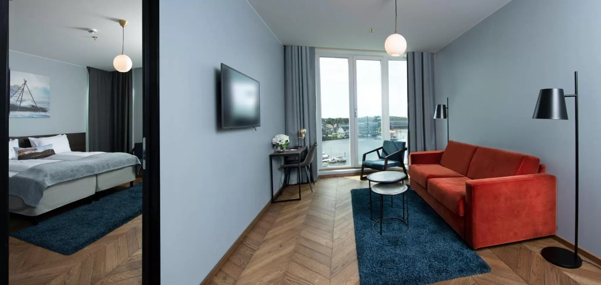 Communal lounge/ TV room, Bed in Mandal Hotel