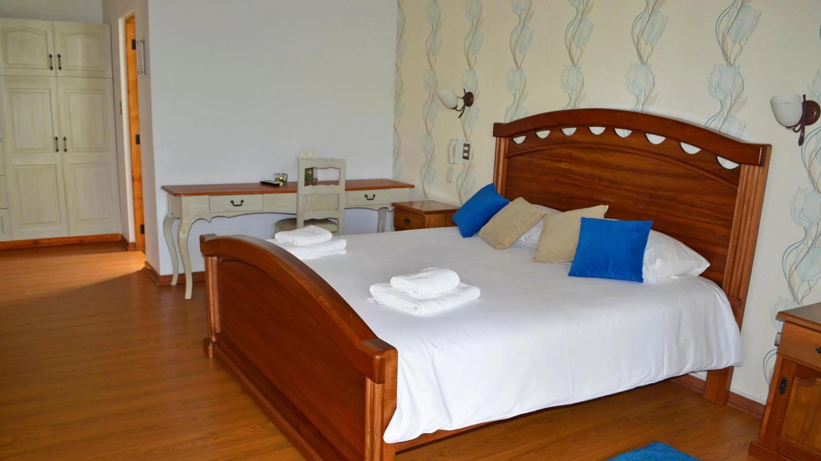 Bed in La Perla Hotel