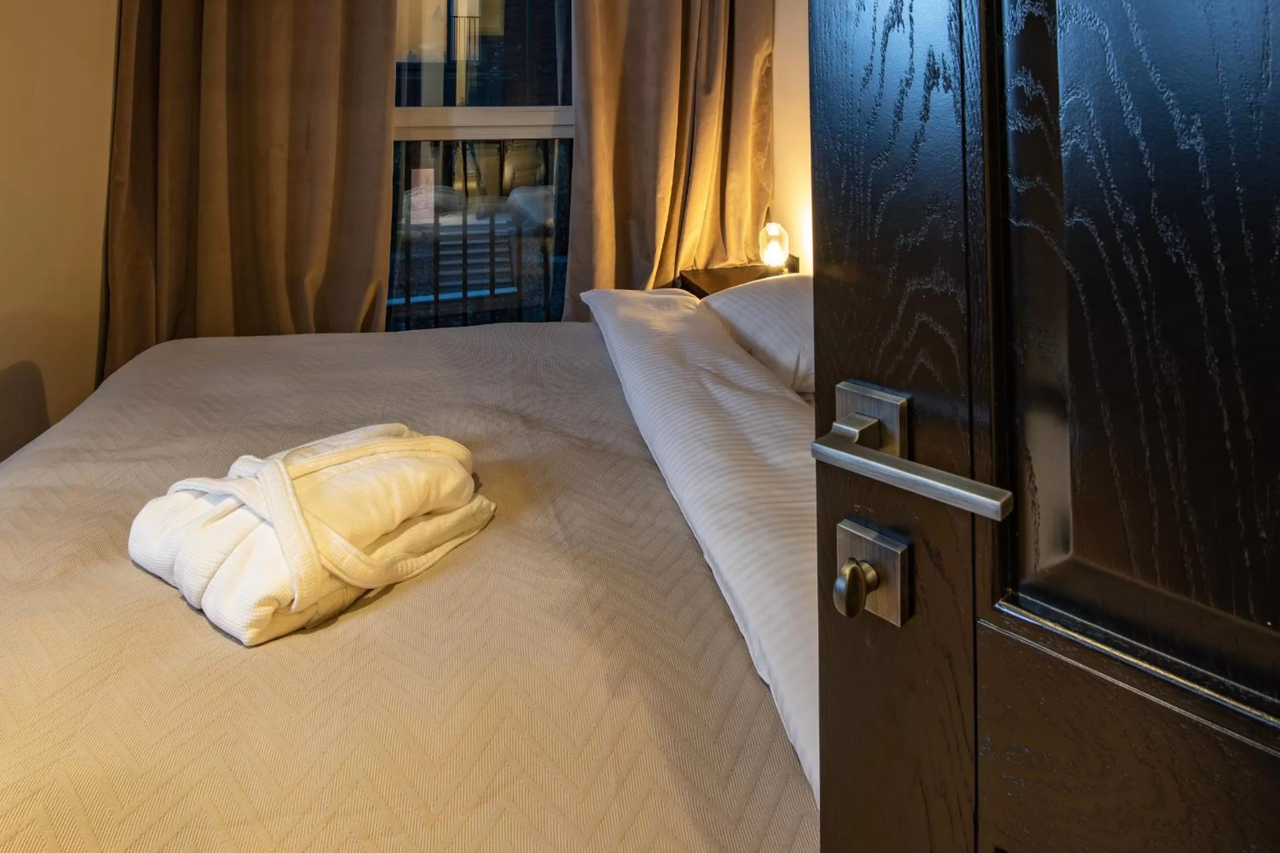 Bed in Warm House Apart Hotel