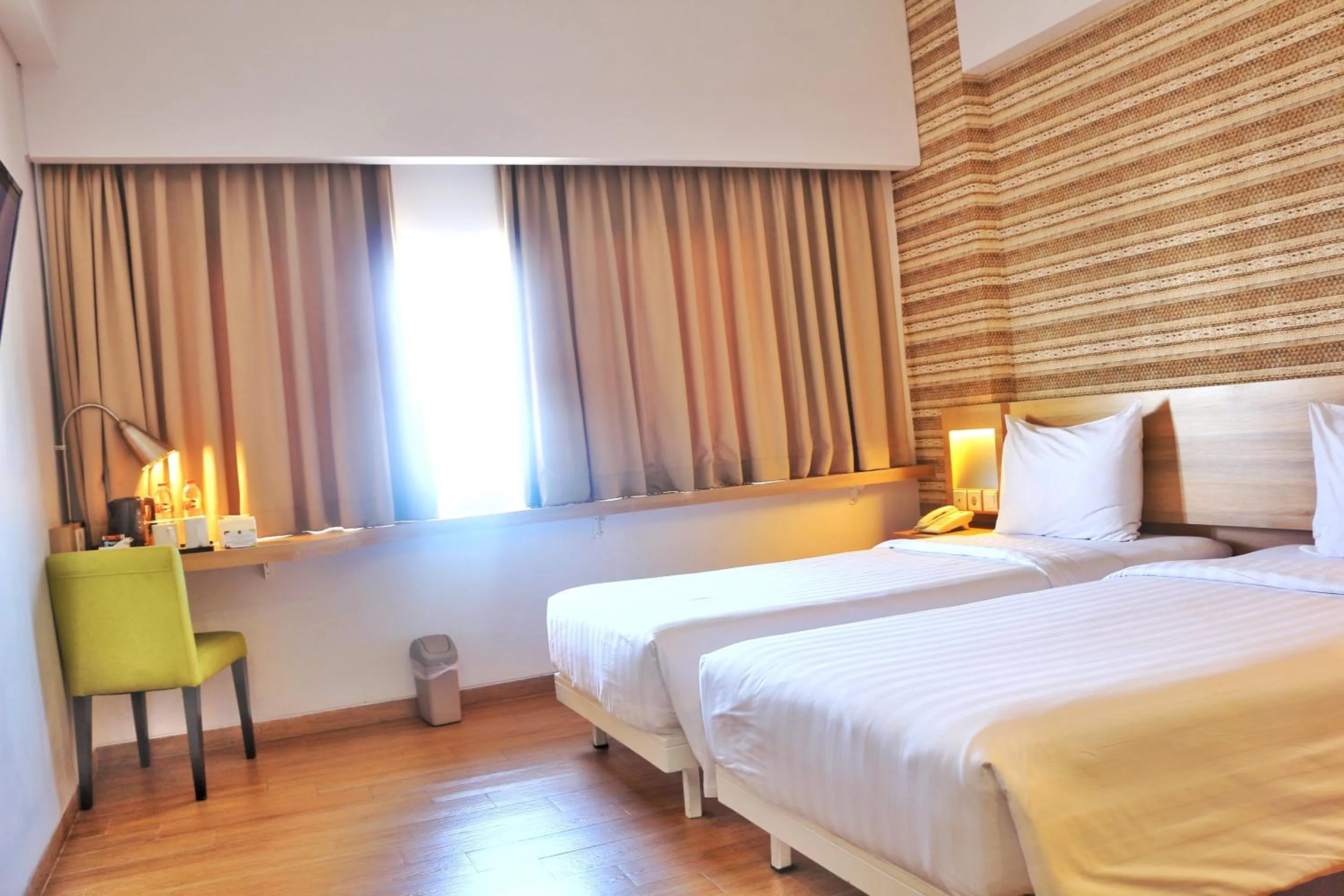 Bed in Whiz Prime Hotel Basuki Rahmat Malang
