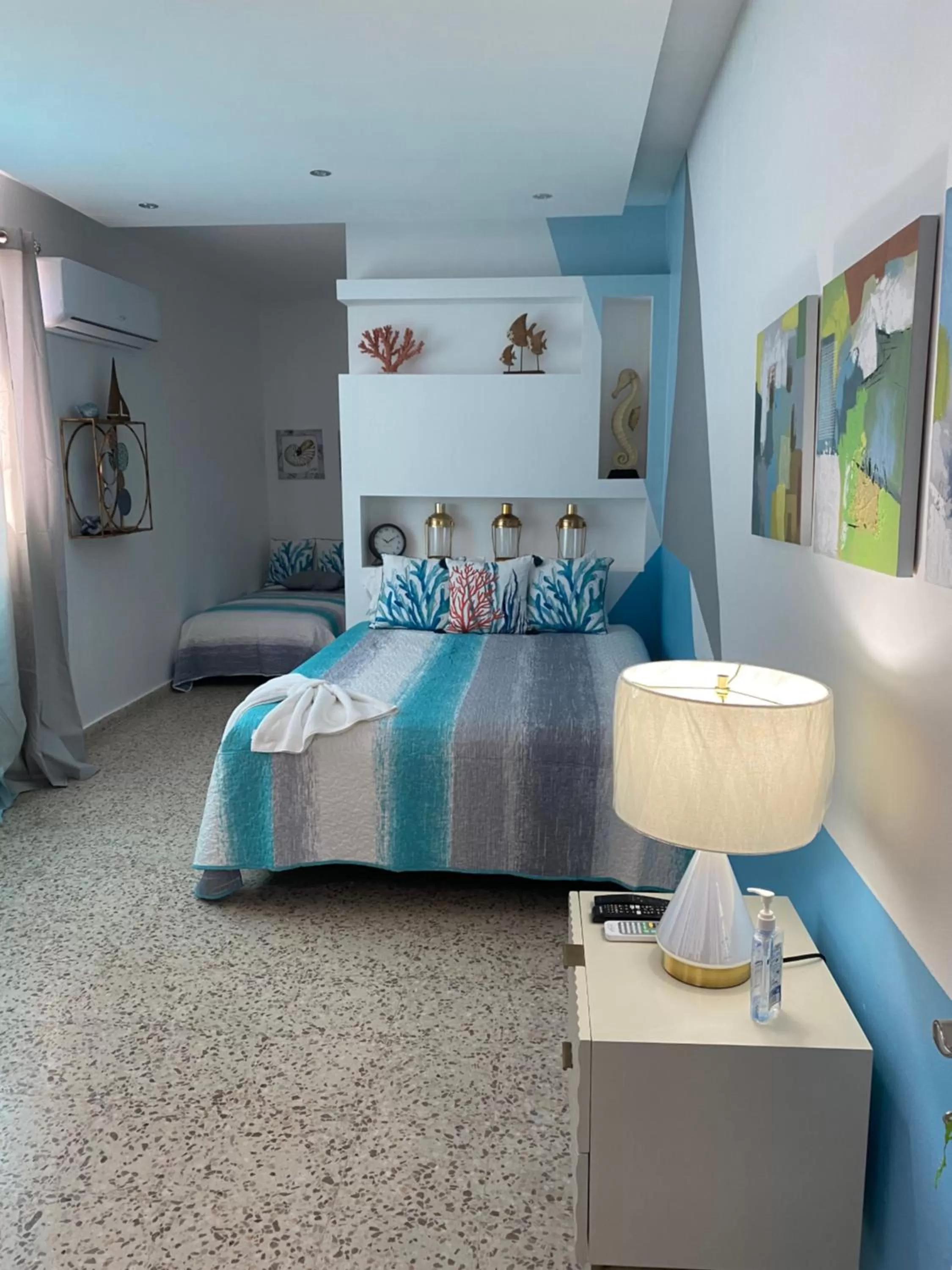 Bed in Itza-Bella Suites