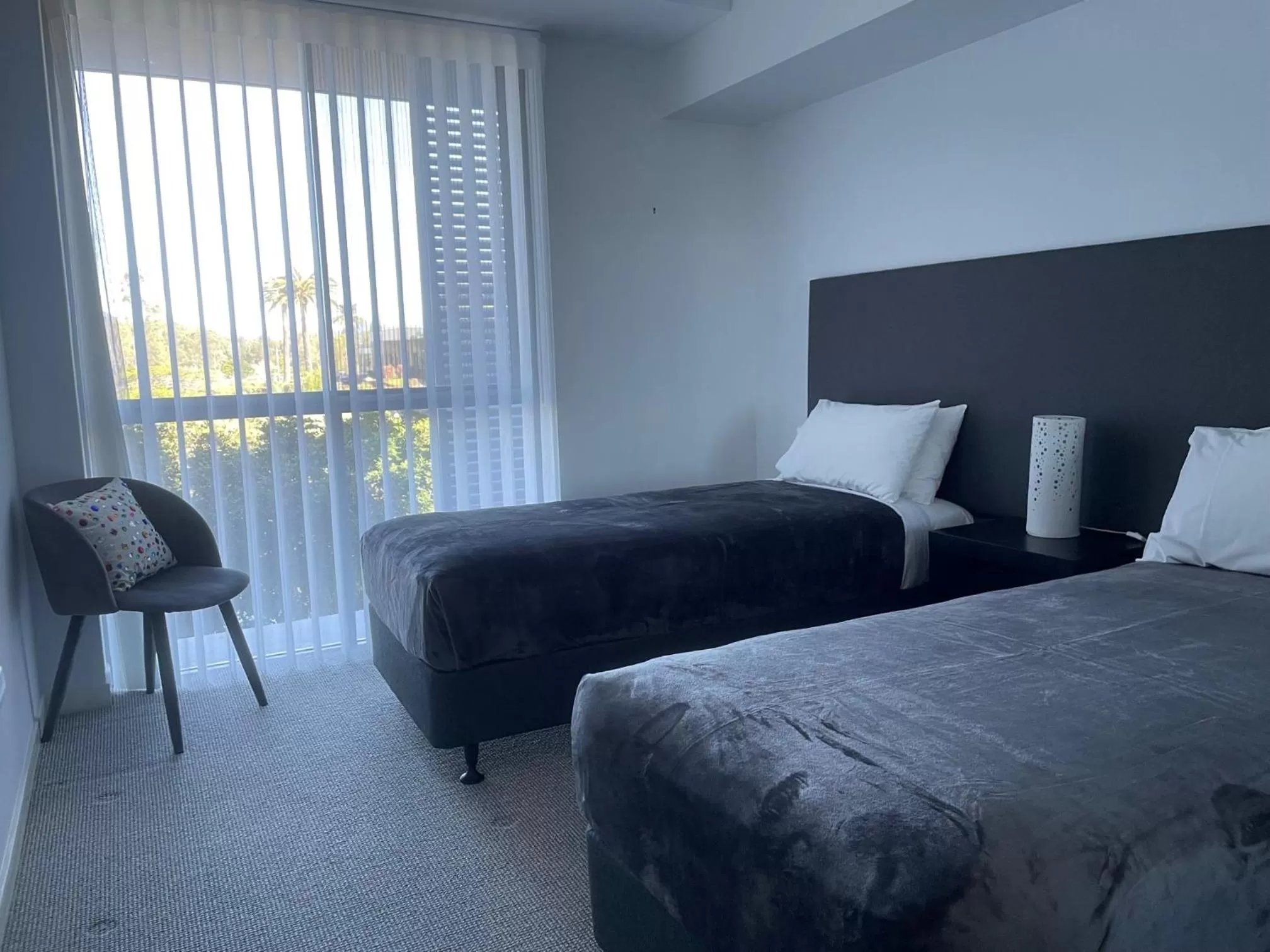 Bed in Signature Waterfront Apartments