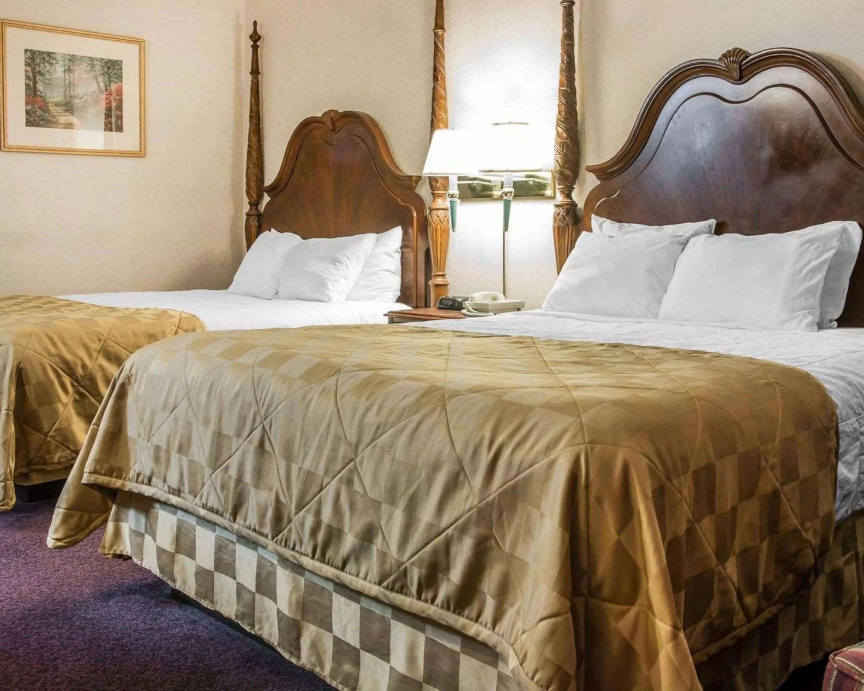 Photo of the whole room, Bed in Clarion Hotel Mackinaw City Beachfront