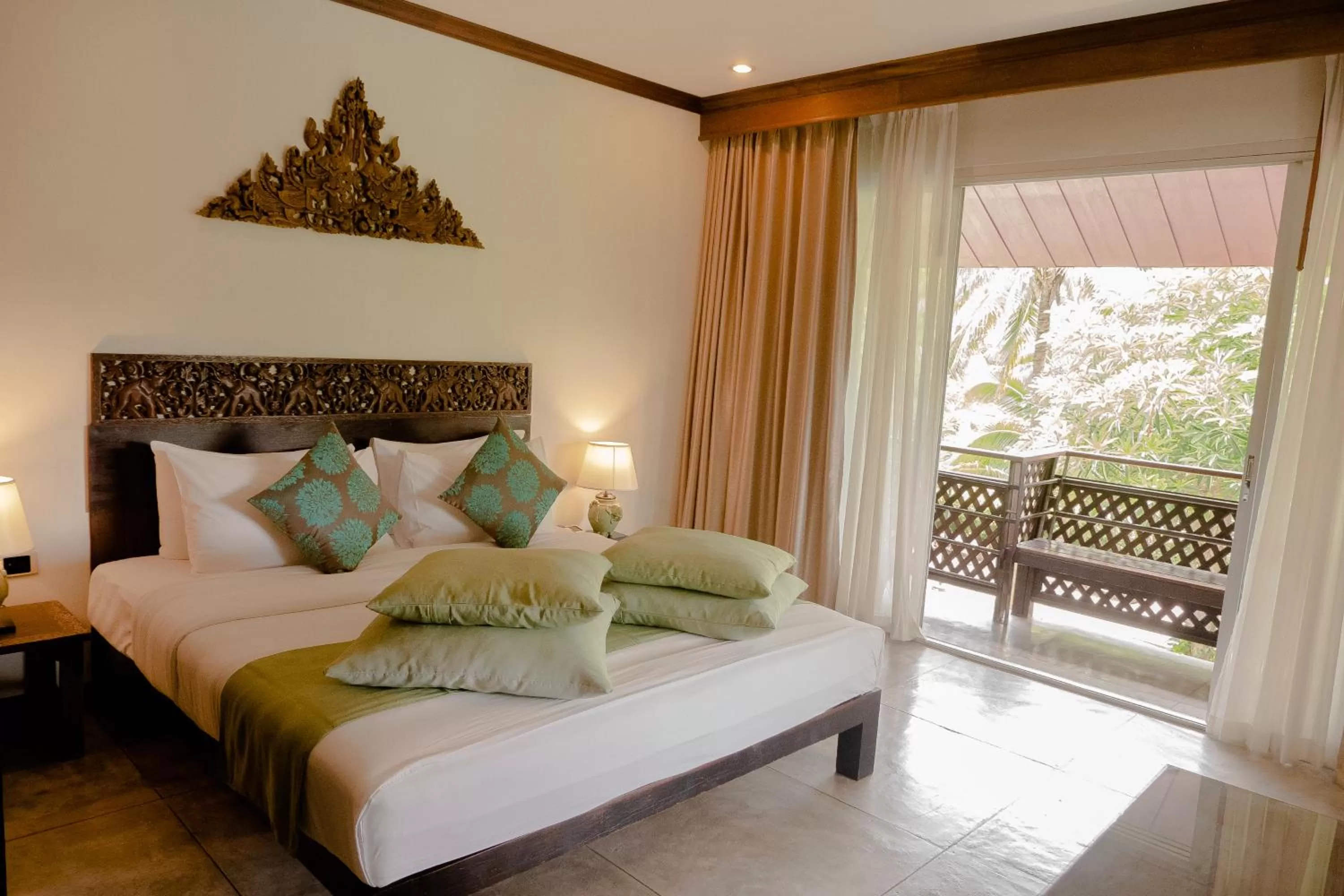 Bed in Royal River Kwai Resort and Spa