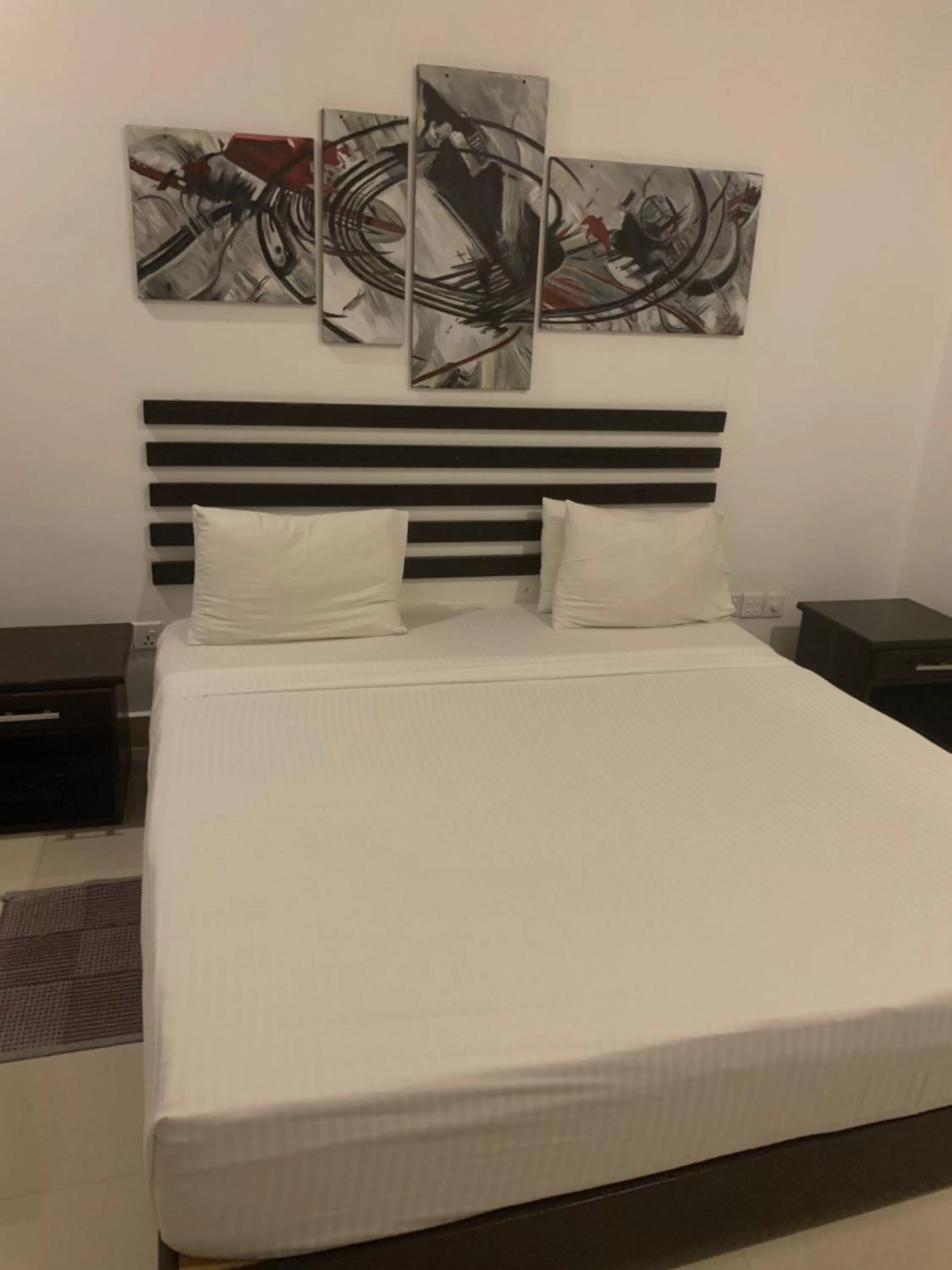 Bed in Sunrise Palace Negombo