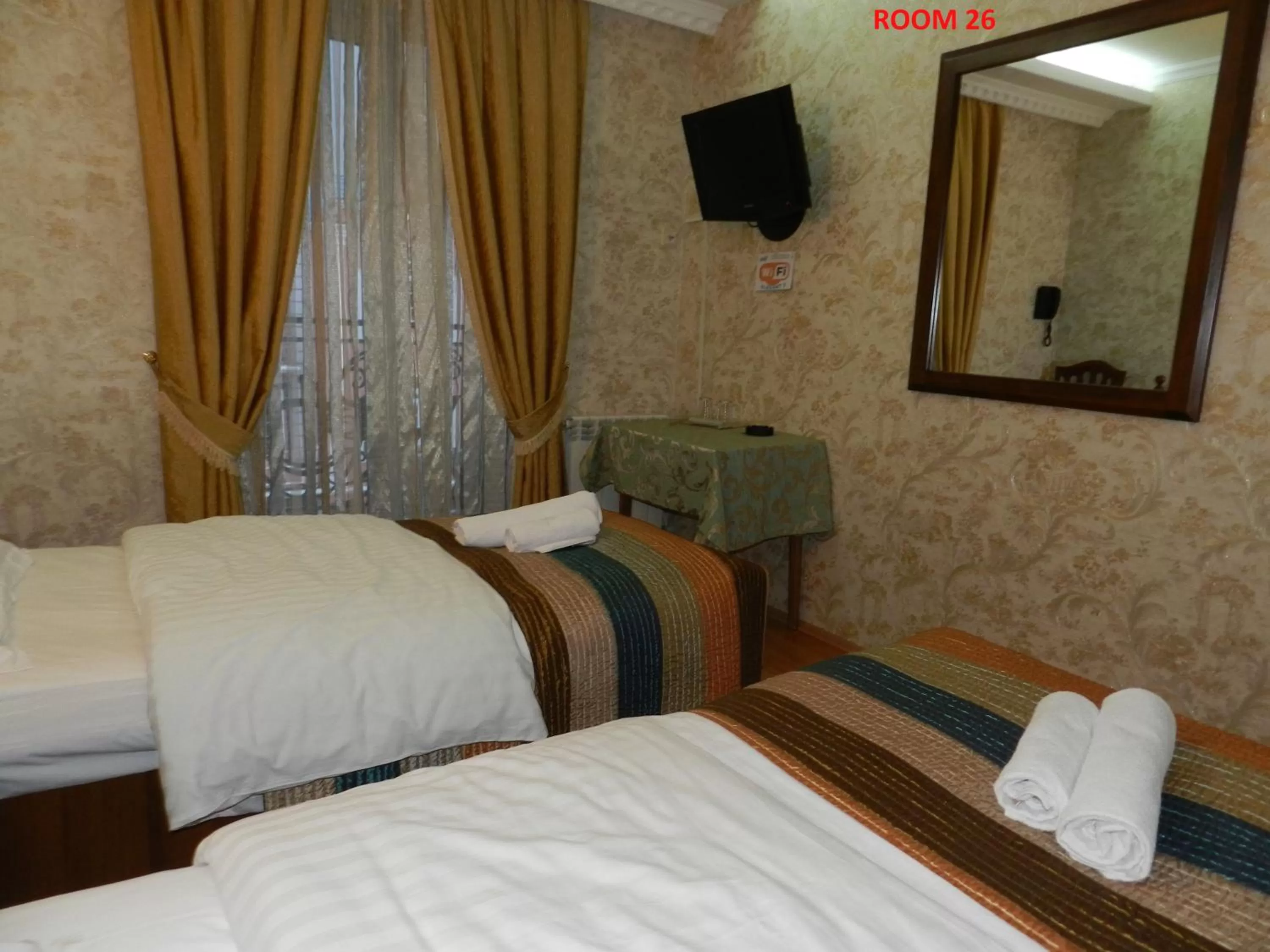 Bed in Hotel Elegant Garden