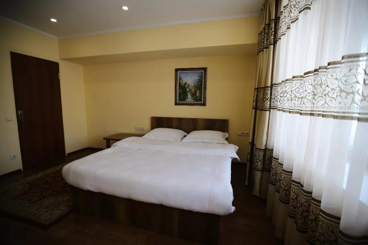 Bed in Altai Business Hotel