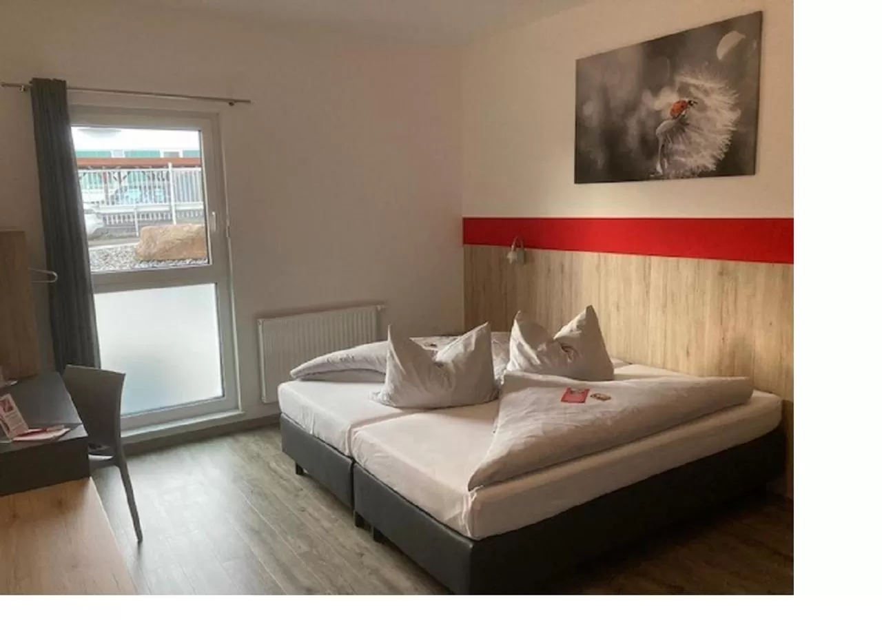 Photo of the whole room, Bed in Hotel Hohenloher Tor