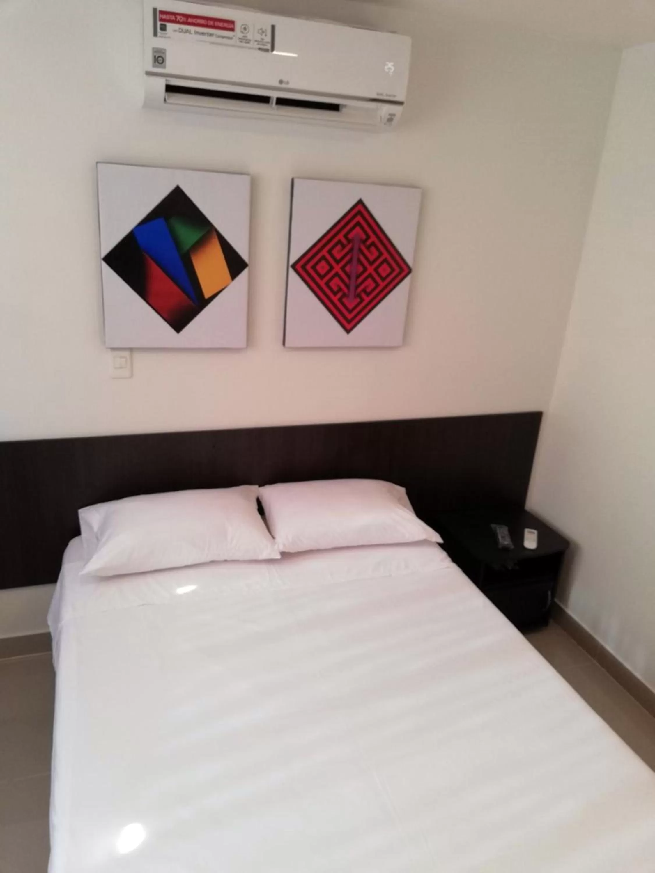 Bed in Apartasuites San Marcos