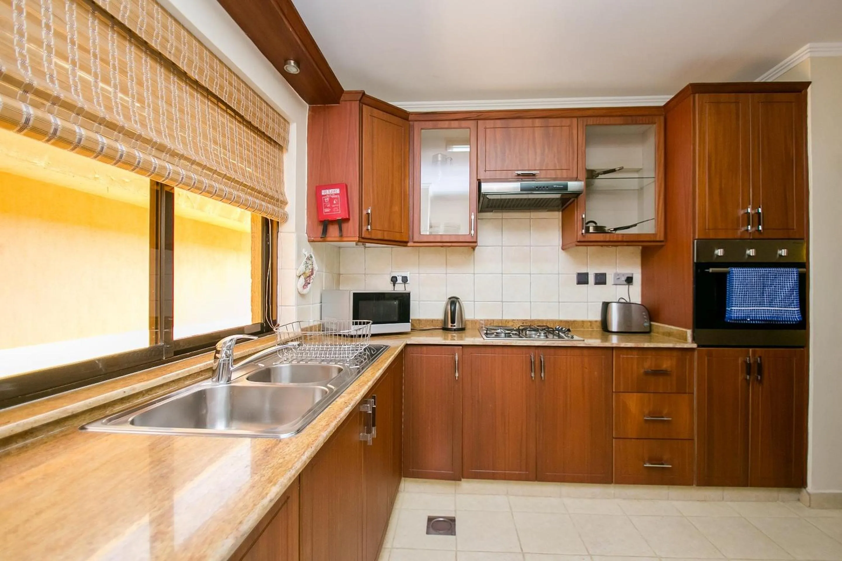 Kitchen or kitchenette in Waridi Paradise Hotel and Suites