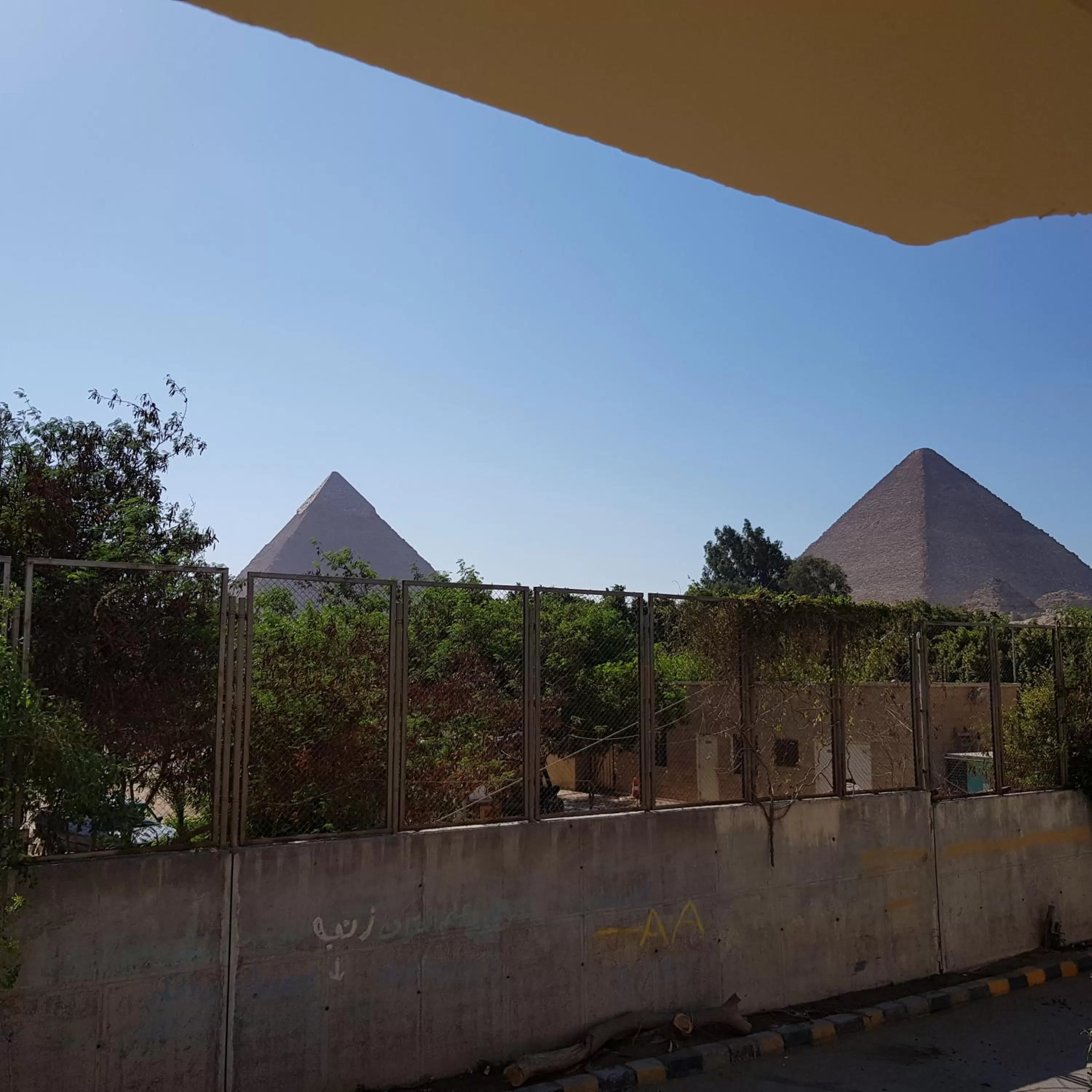 Sphinx palace pyramids view