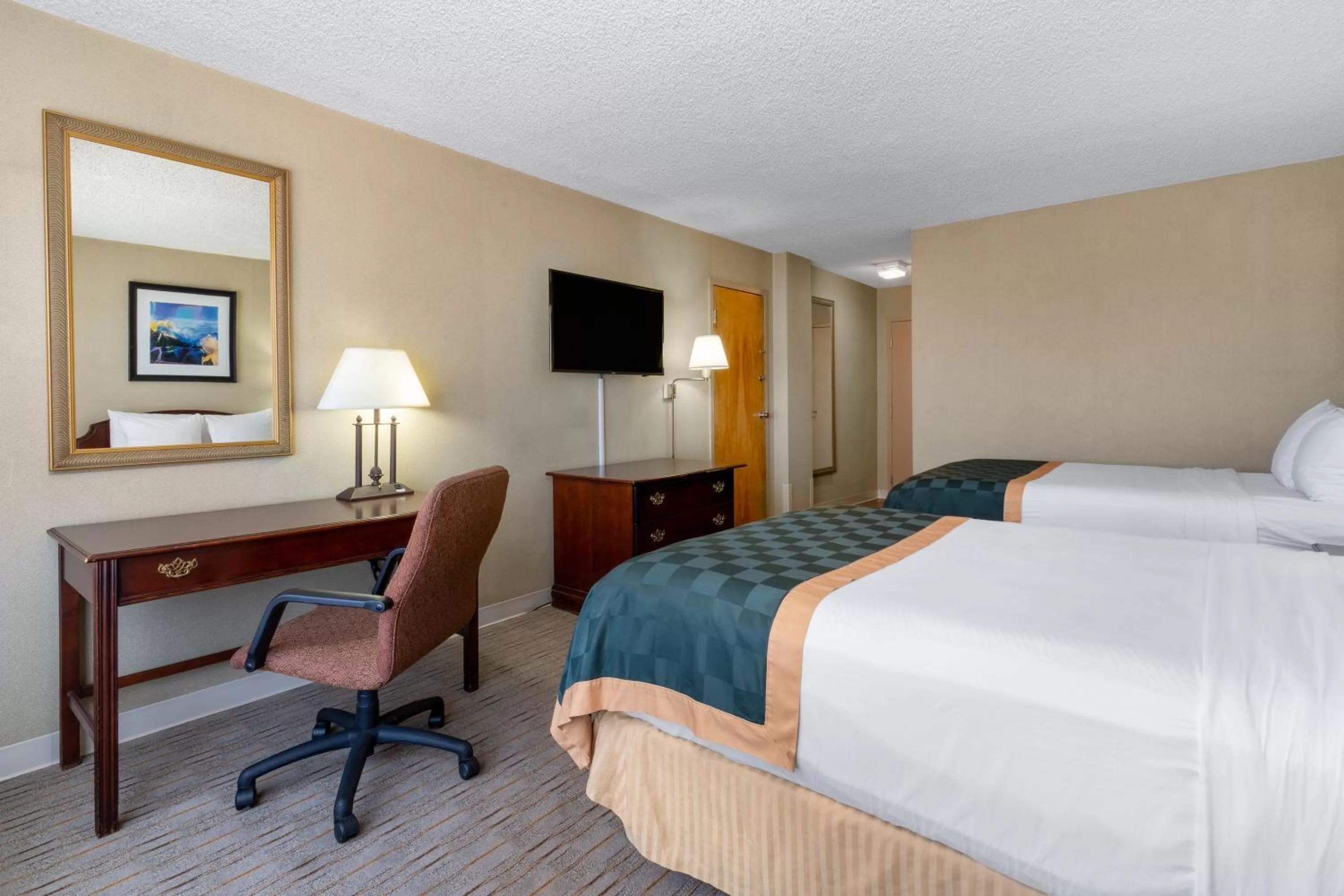 Bed in Ramada by Wyndham Reno Hotel & Casino