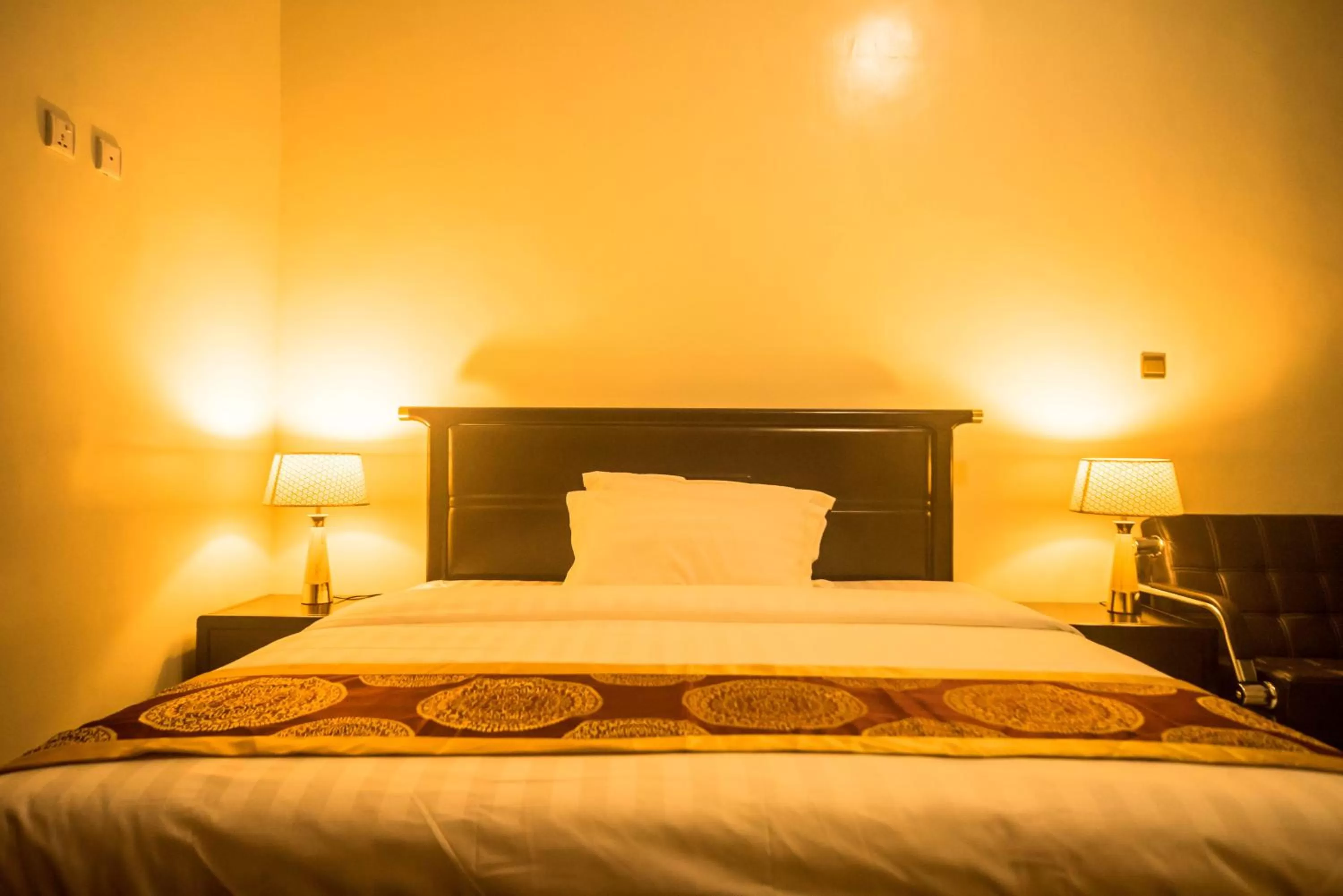 Bed in AVISHA TOWN HOTEL