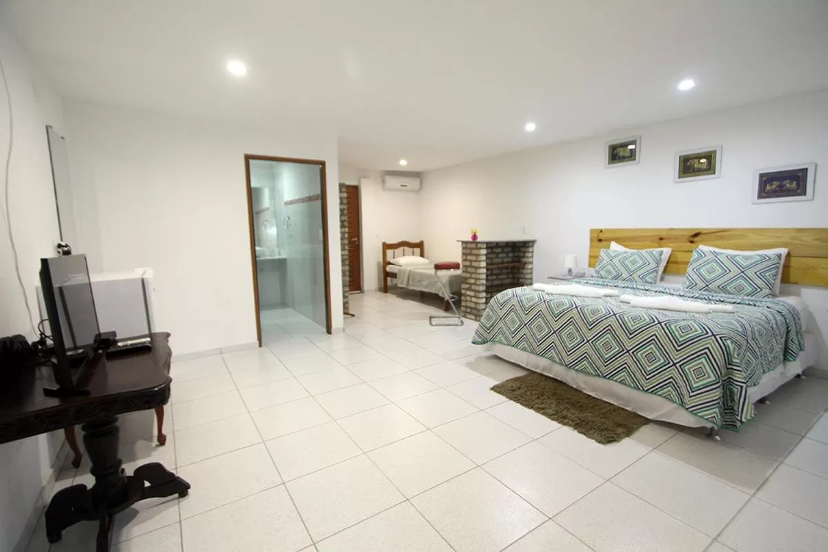 Photo of the whole room, TV/Entertainment Center in Pousada Recanto da Praia