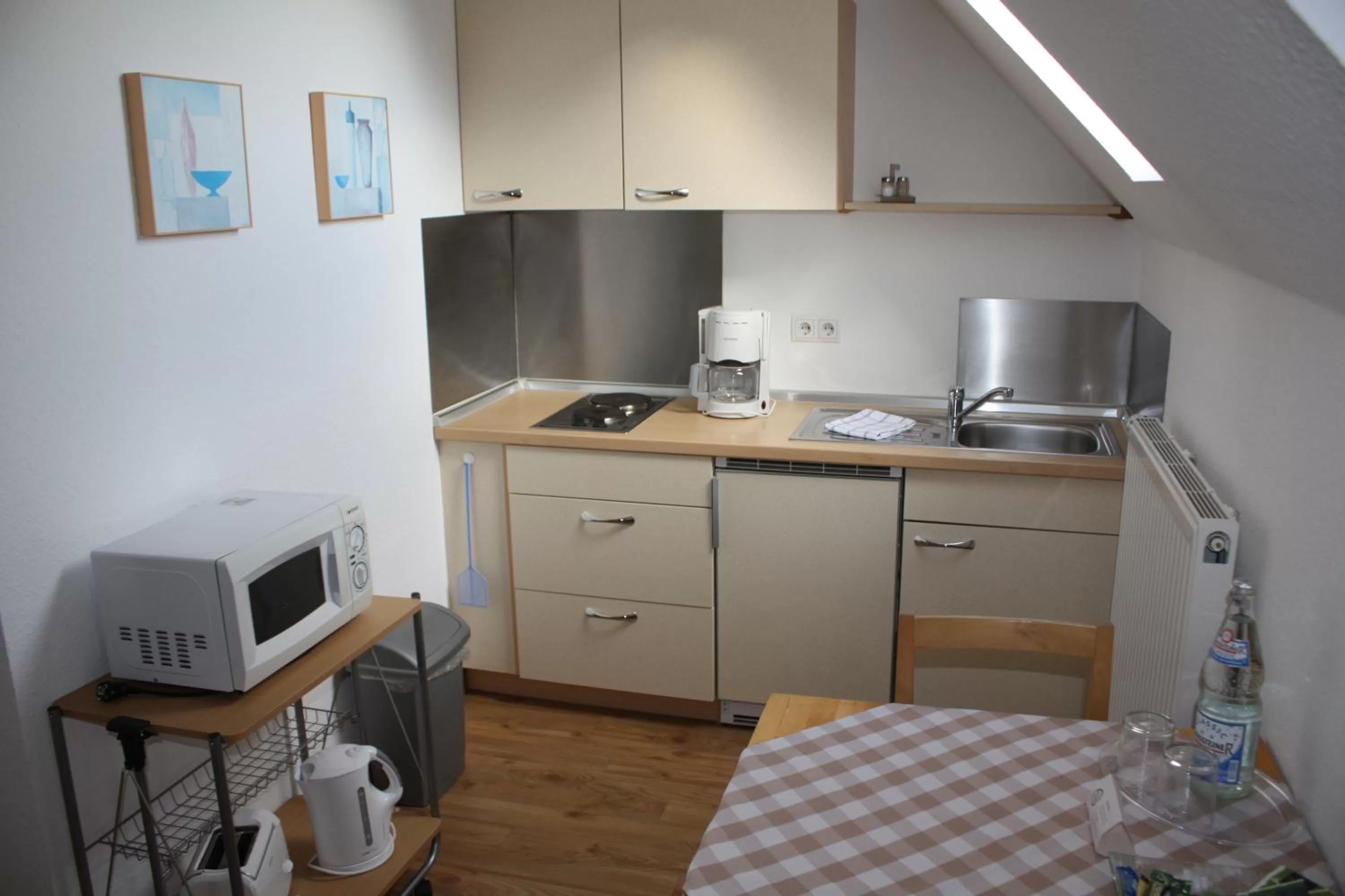 Kitchen or kitchenette in Hotel Am Wintergarten