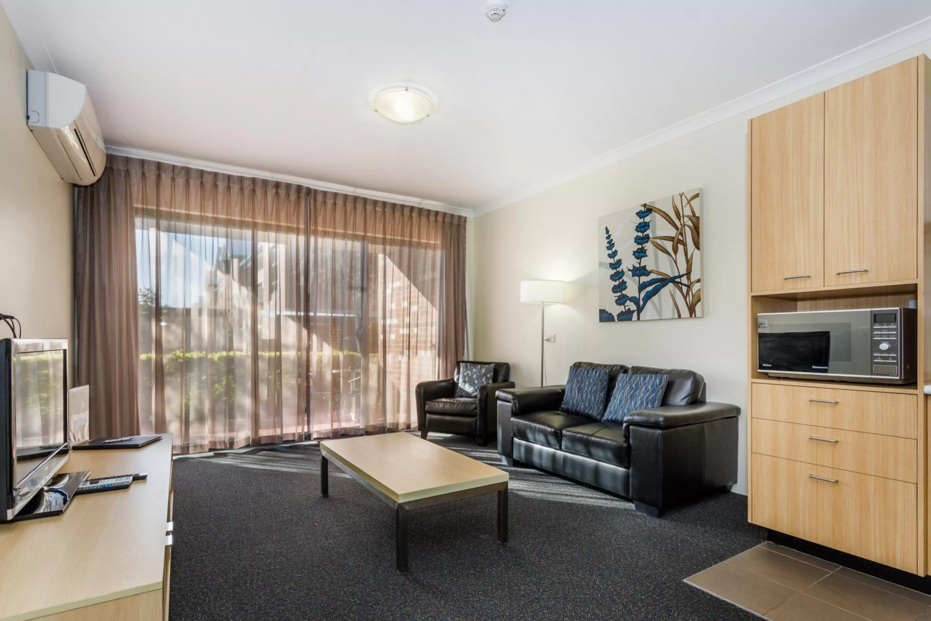 Living room in Perth Ascot Central Apartment Hotel Official