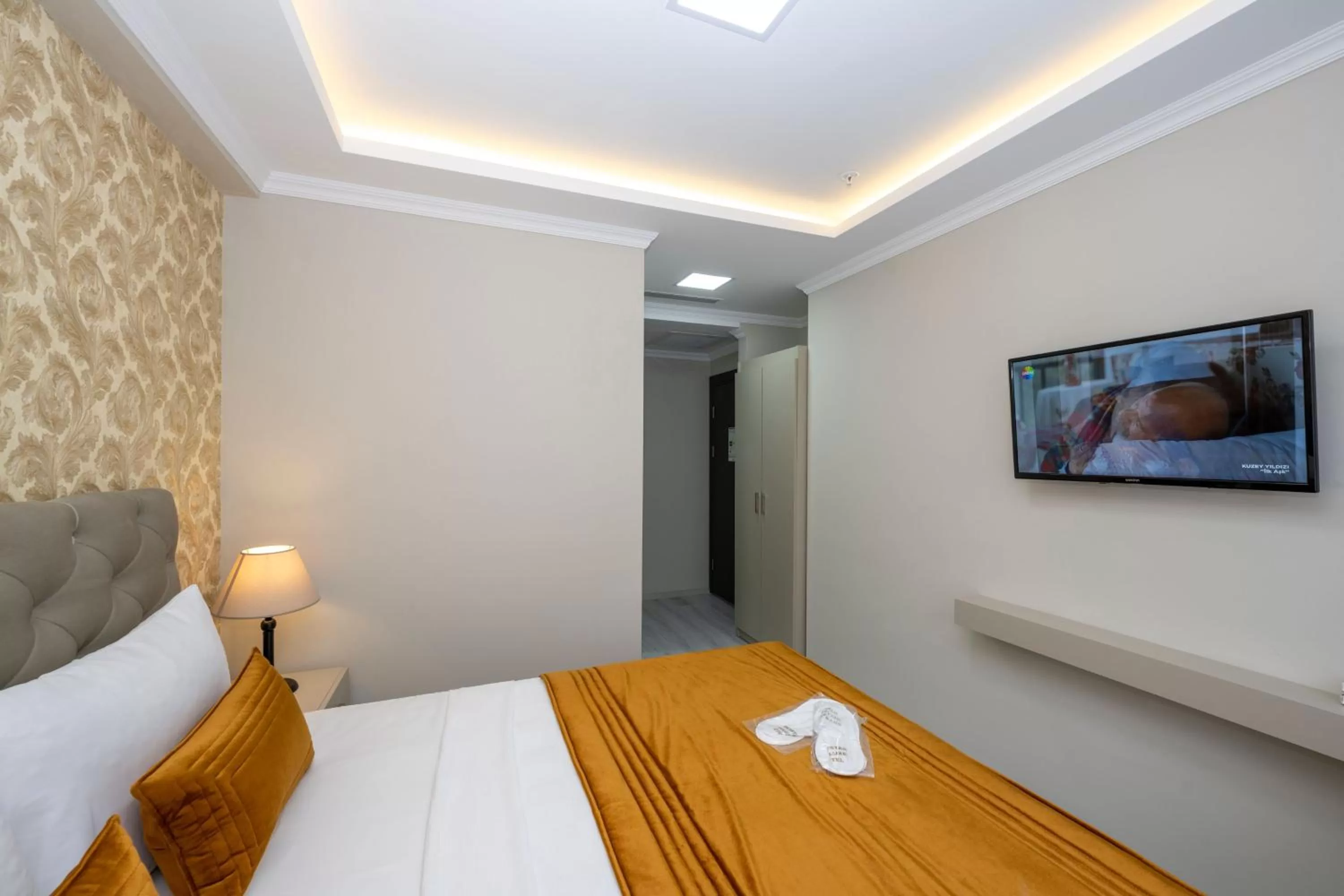 Bed in SKYSTAR DELUXE HOTEL