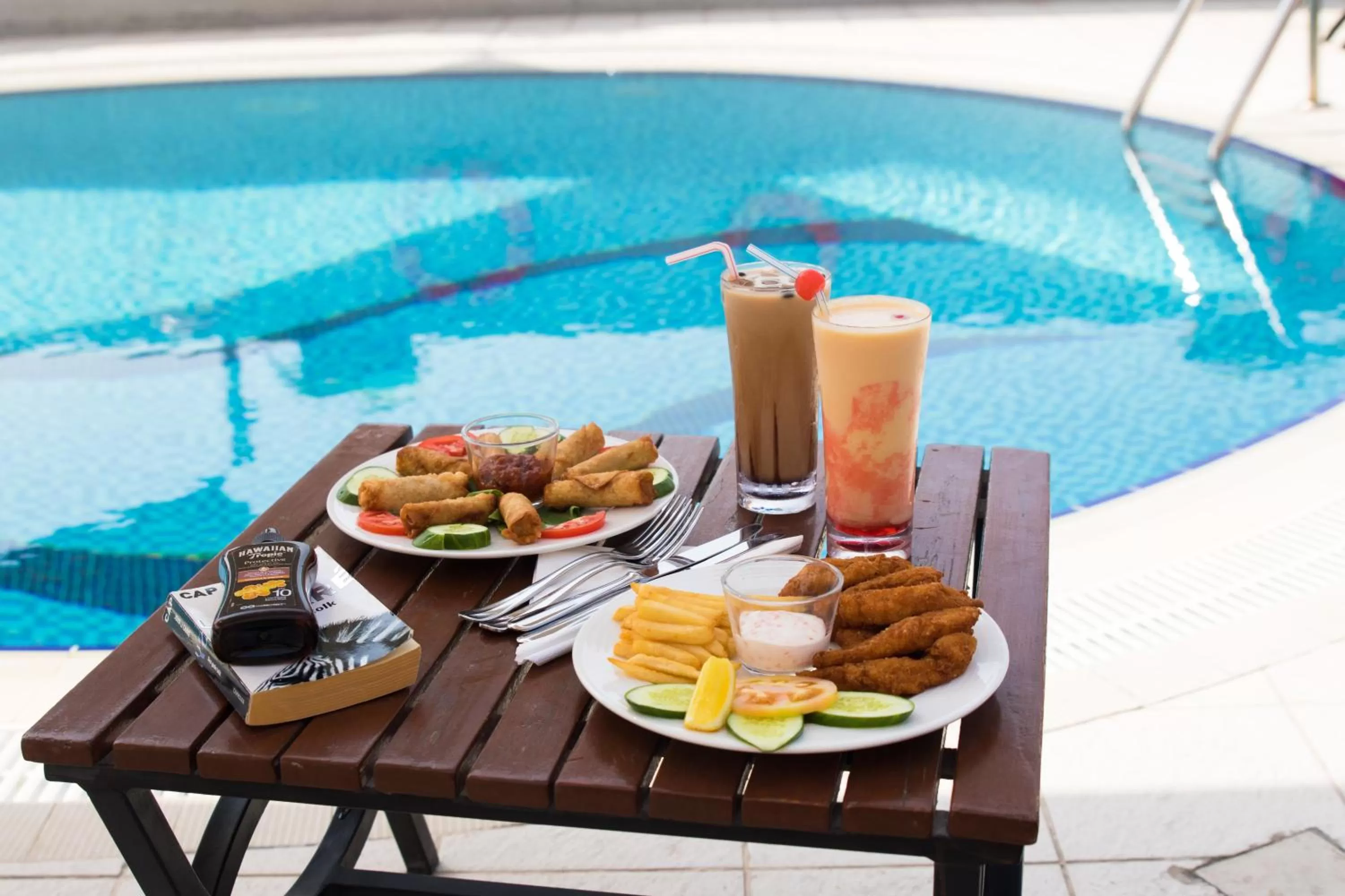 Swimming pool in Savoy Crest Hotel Apartments