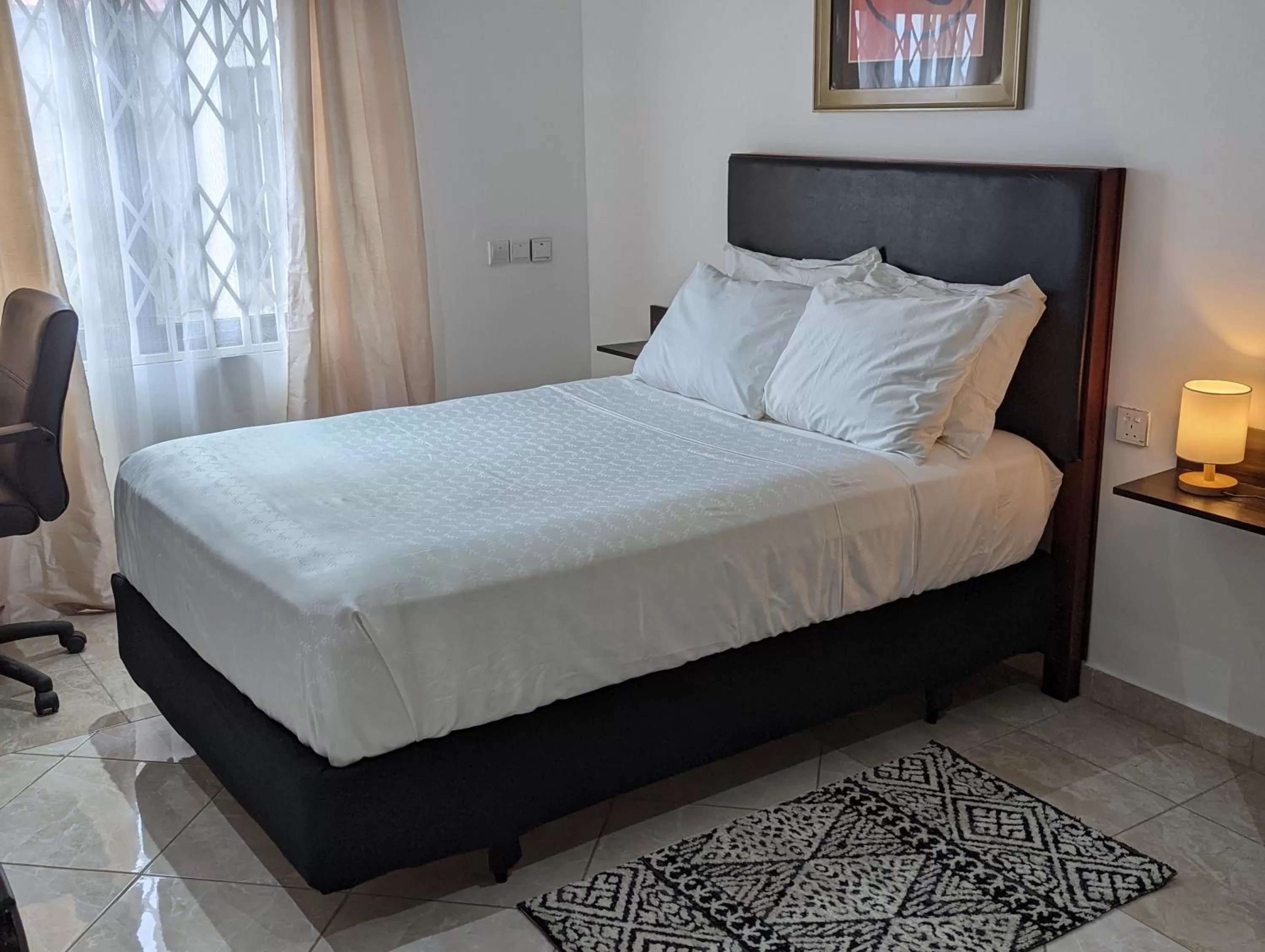 Bed in KoKo Palm Inn LTD