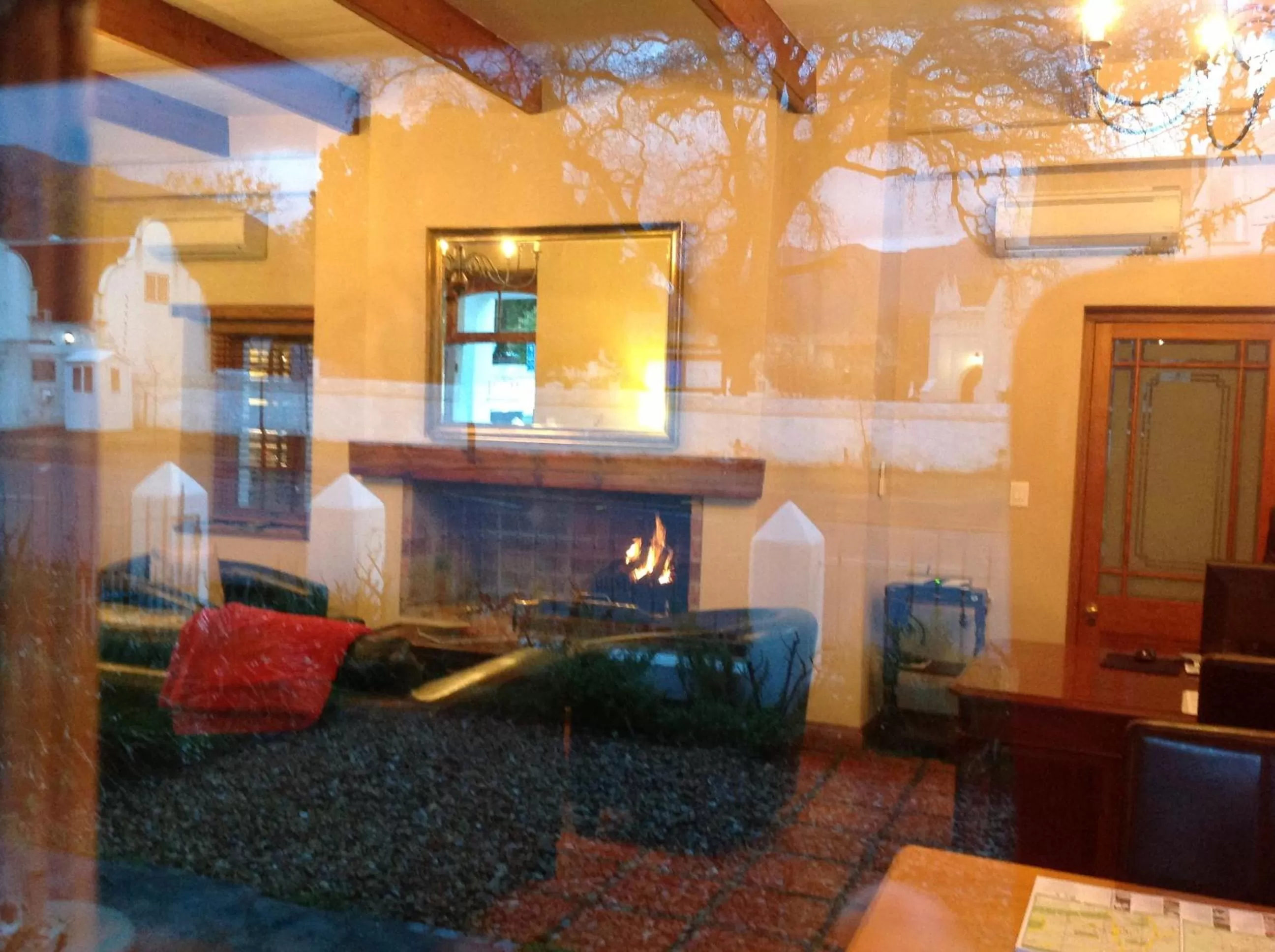 Communal lounge/ TV room in De Hoek Manor