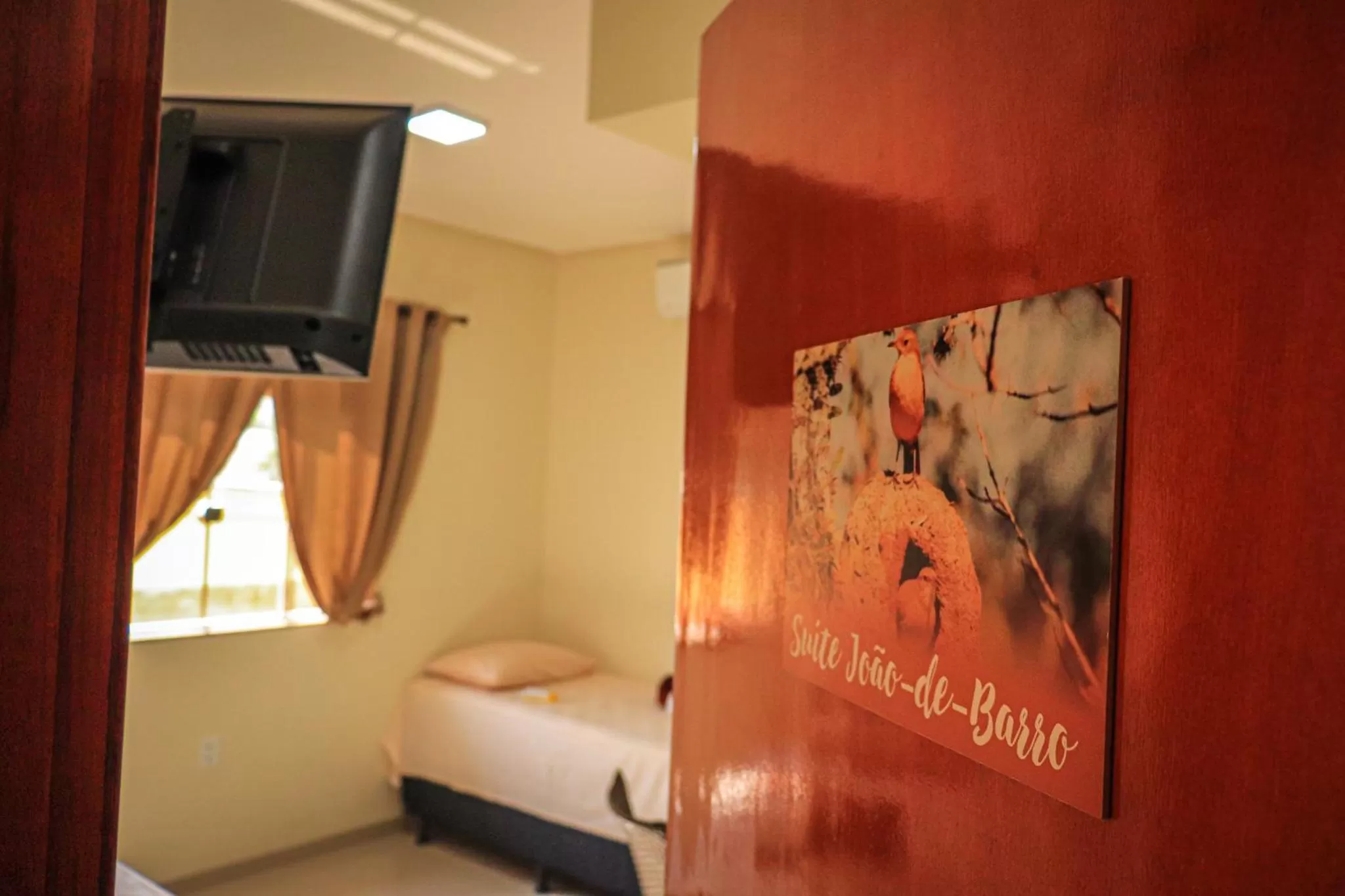 Communal lounge/ TV room, TV/Entertainment Center in Pousada Casa Grande