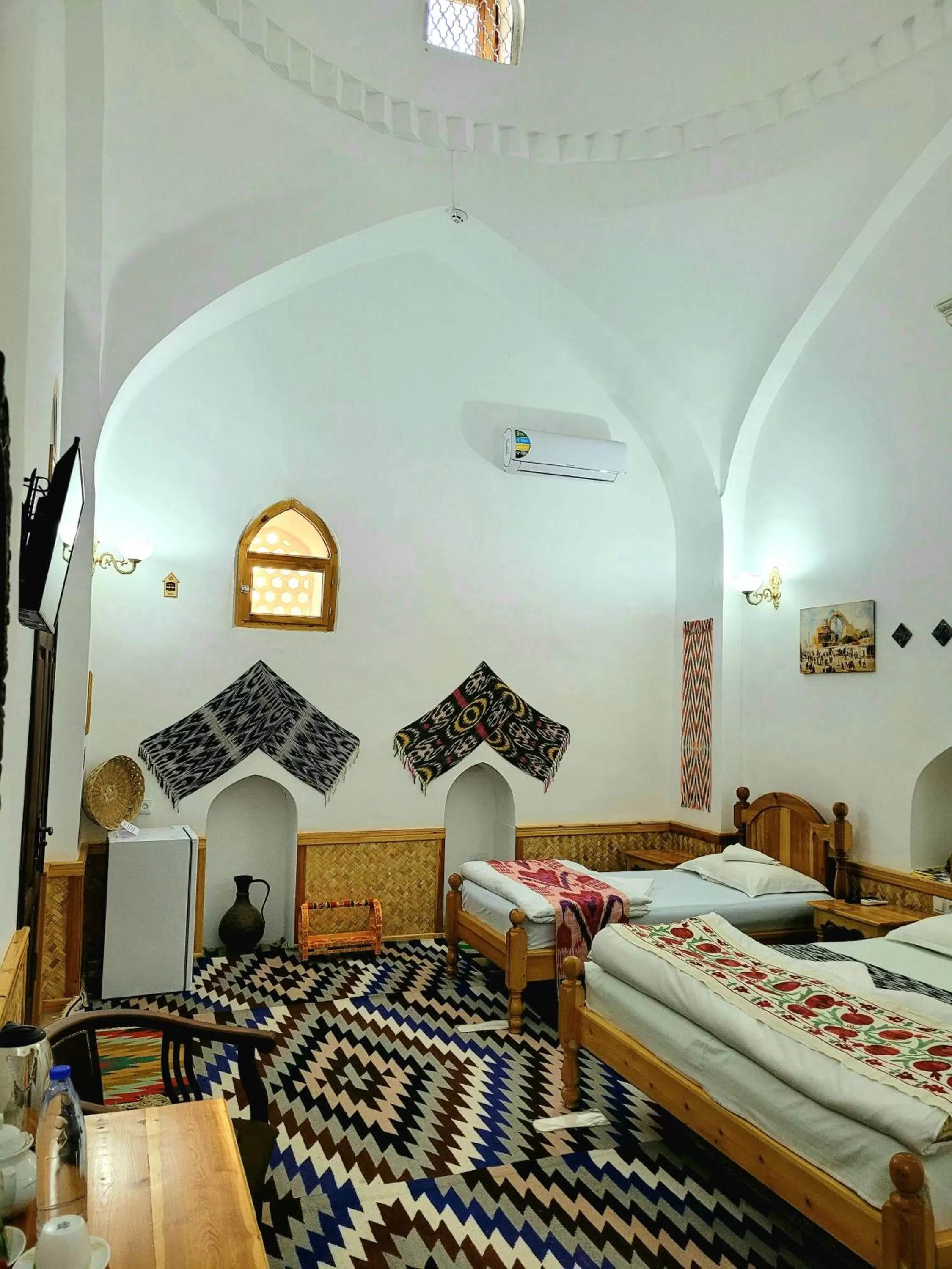 Bed in madrasah Polvon-Qori boutique hotel