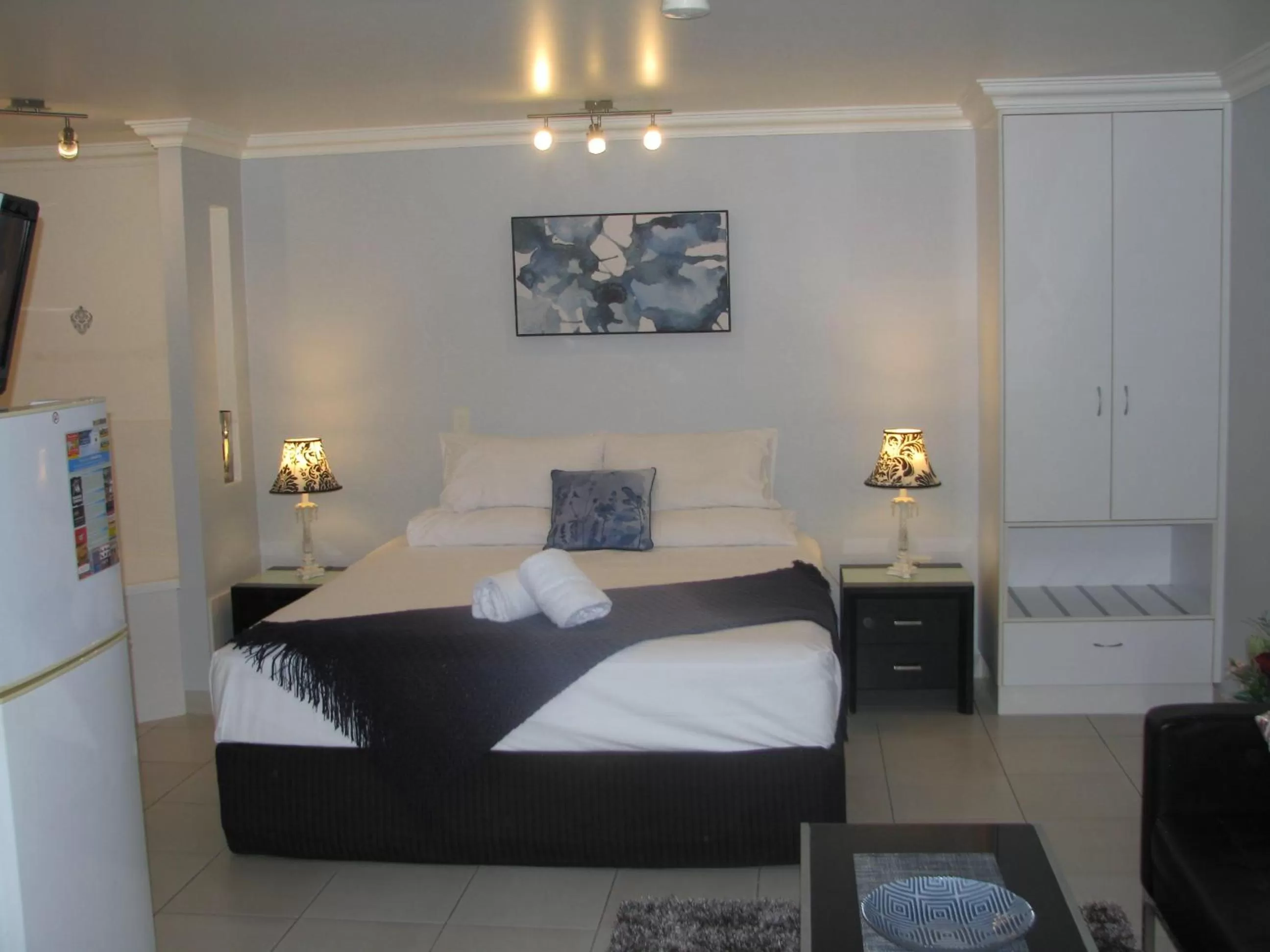 Bed in Charm City Motel