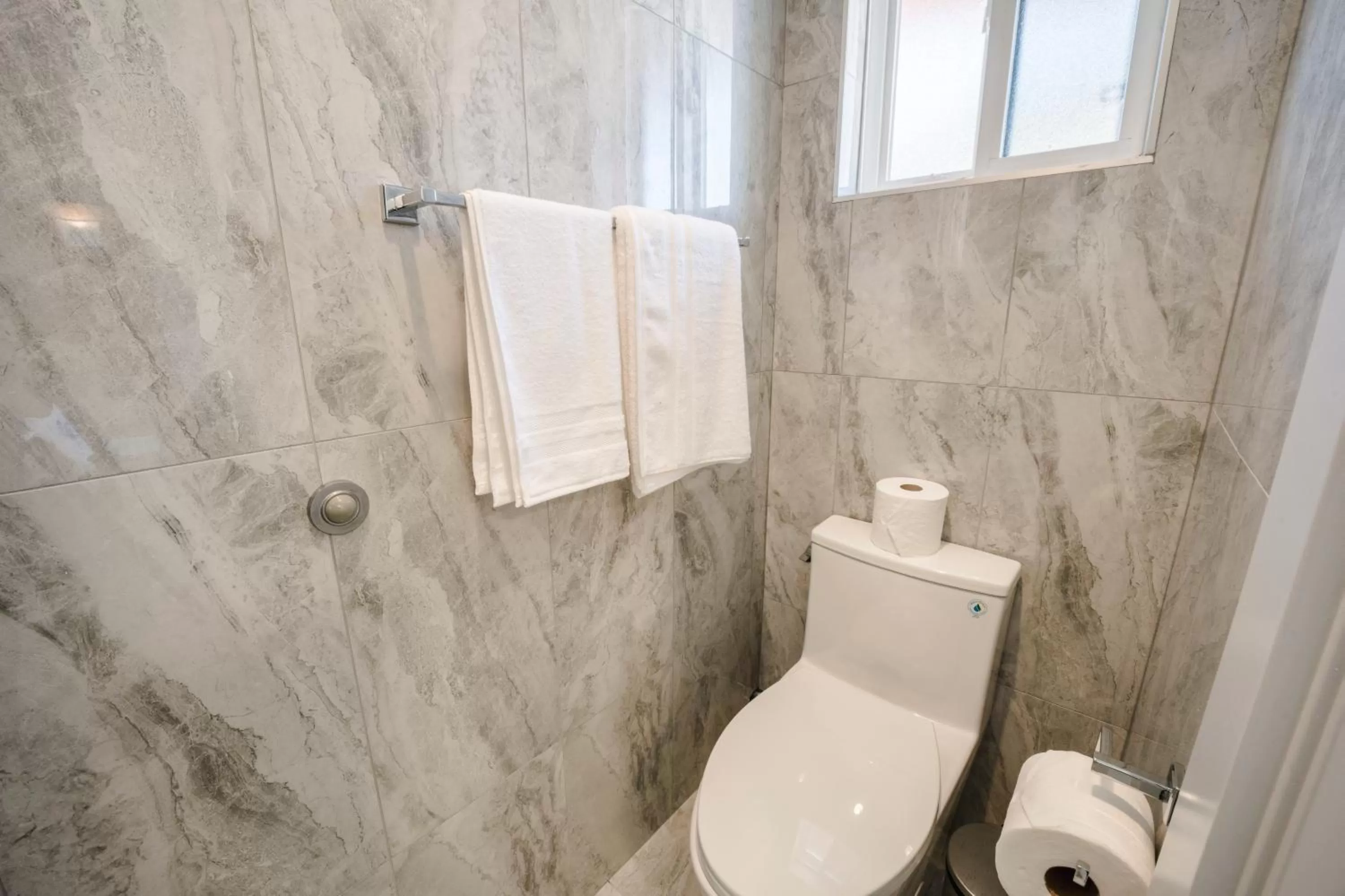 Toilet in Harrison Grand Motel