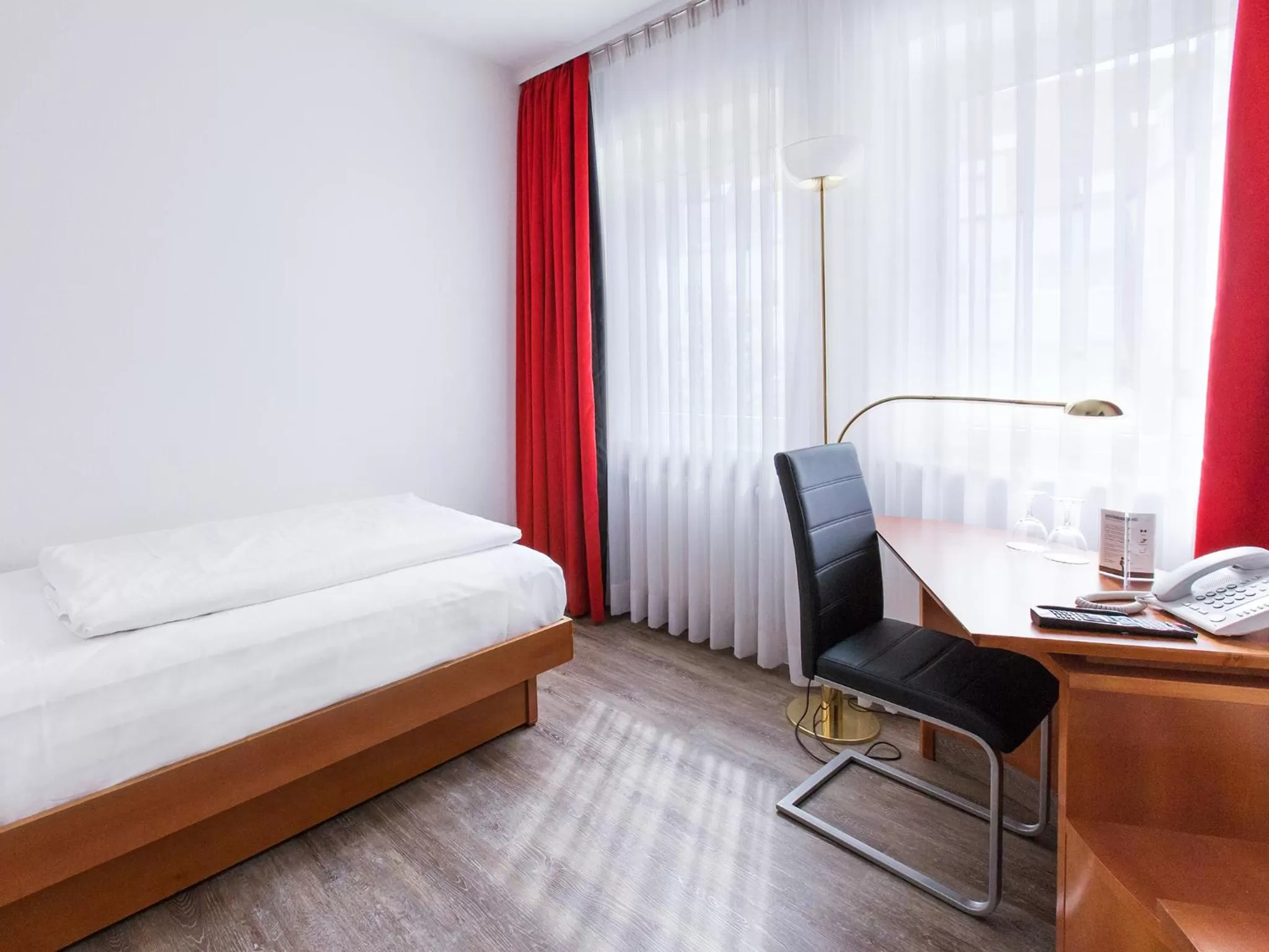 Photo of the whole room, Bed in DORMERO Hotel Dresden Airport