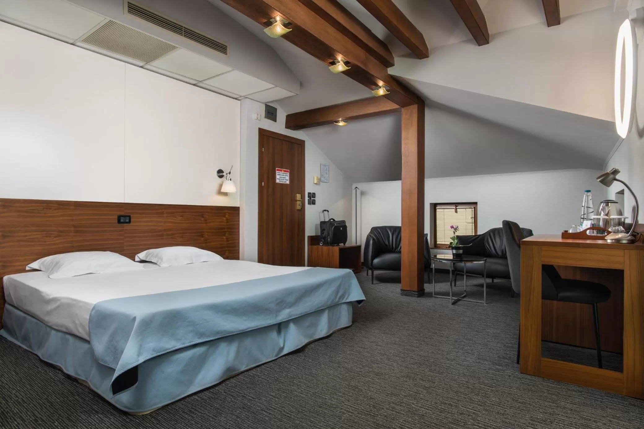 Bed in Uniqato Hotel