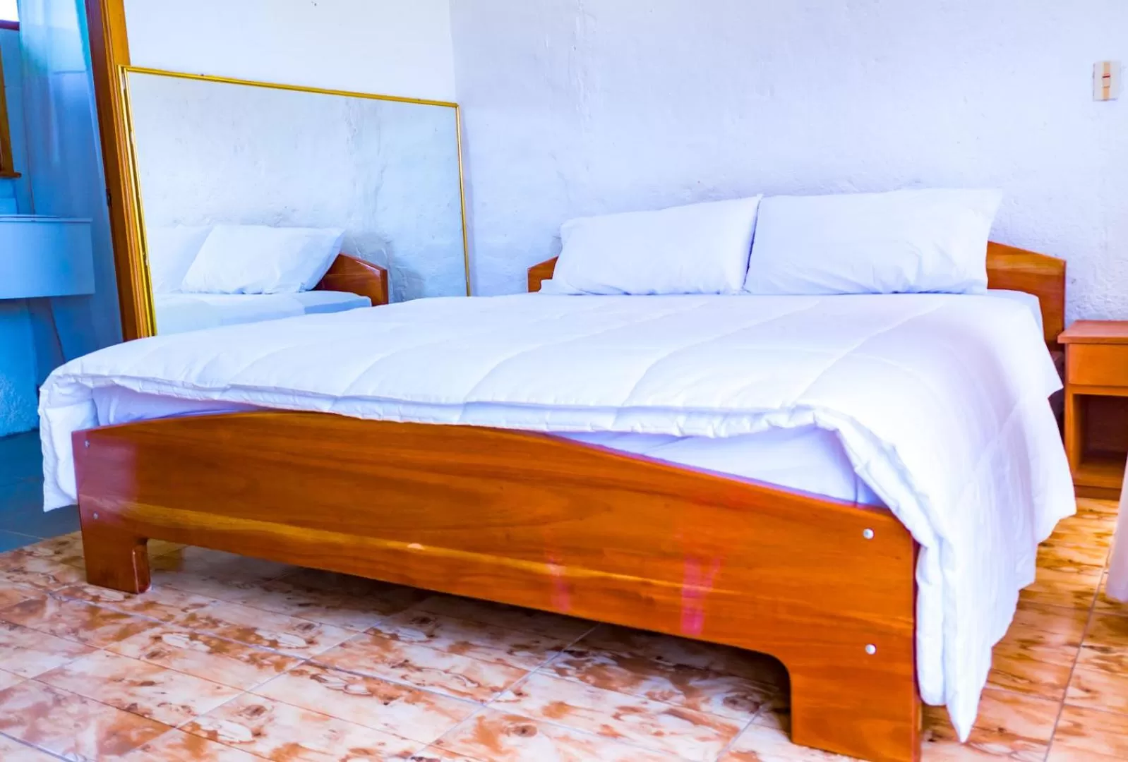 Bed in Royal Galápagos Inn
