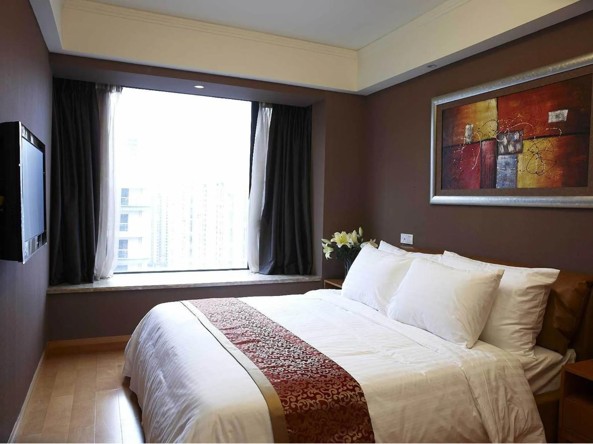 Bed in 广州丹顿行政公寓-Dan Executive Apartment Guangzhou Zhujiang New Town