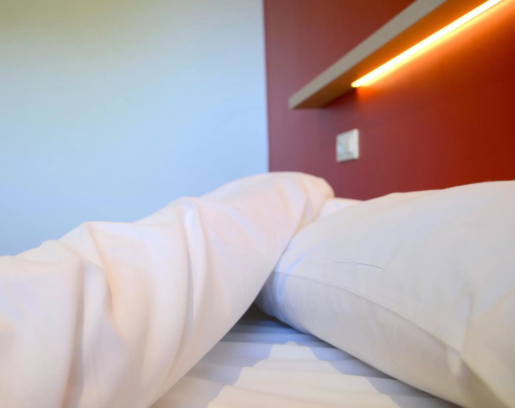 Bed in Eklo Hotels Le Mans