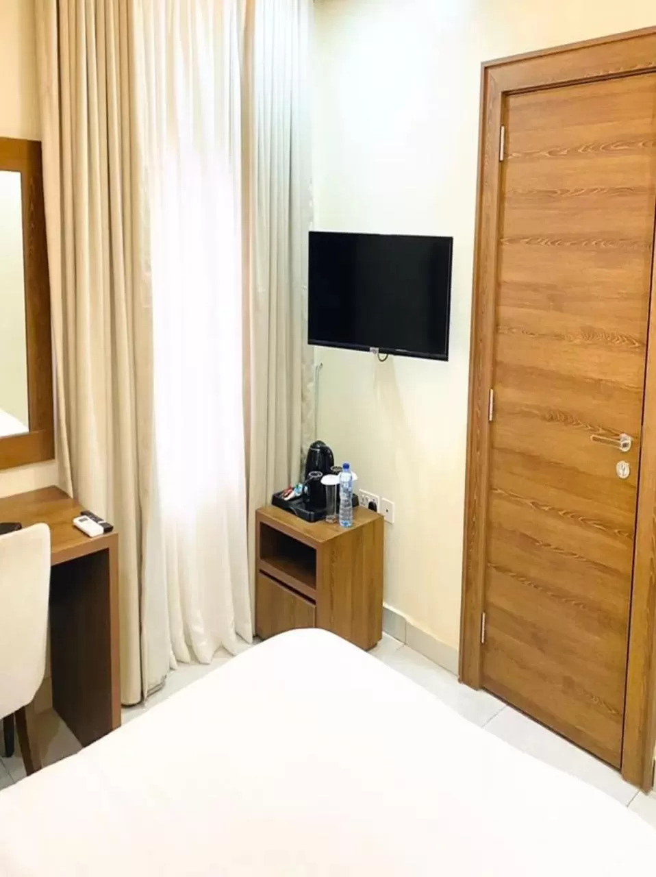 Bed, TV/Entertainment Center in Plush Hotel,Abuja