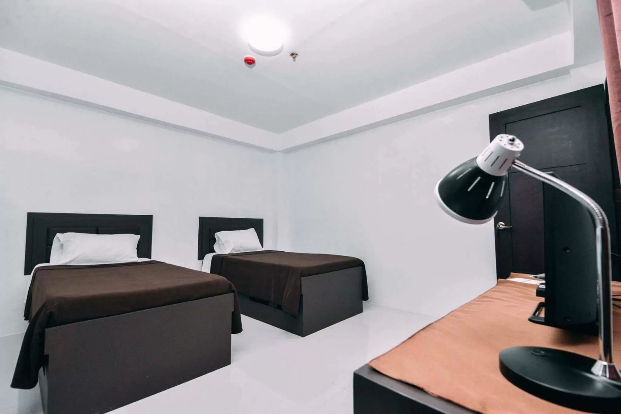 Bedroom, Bed in The Strand Suites and Dormitel