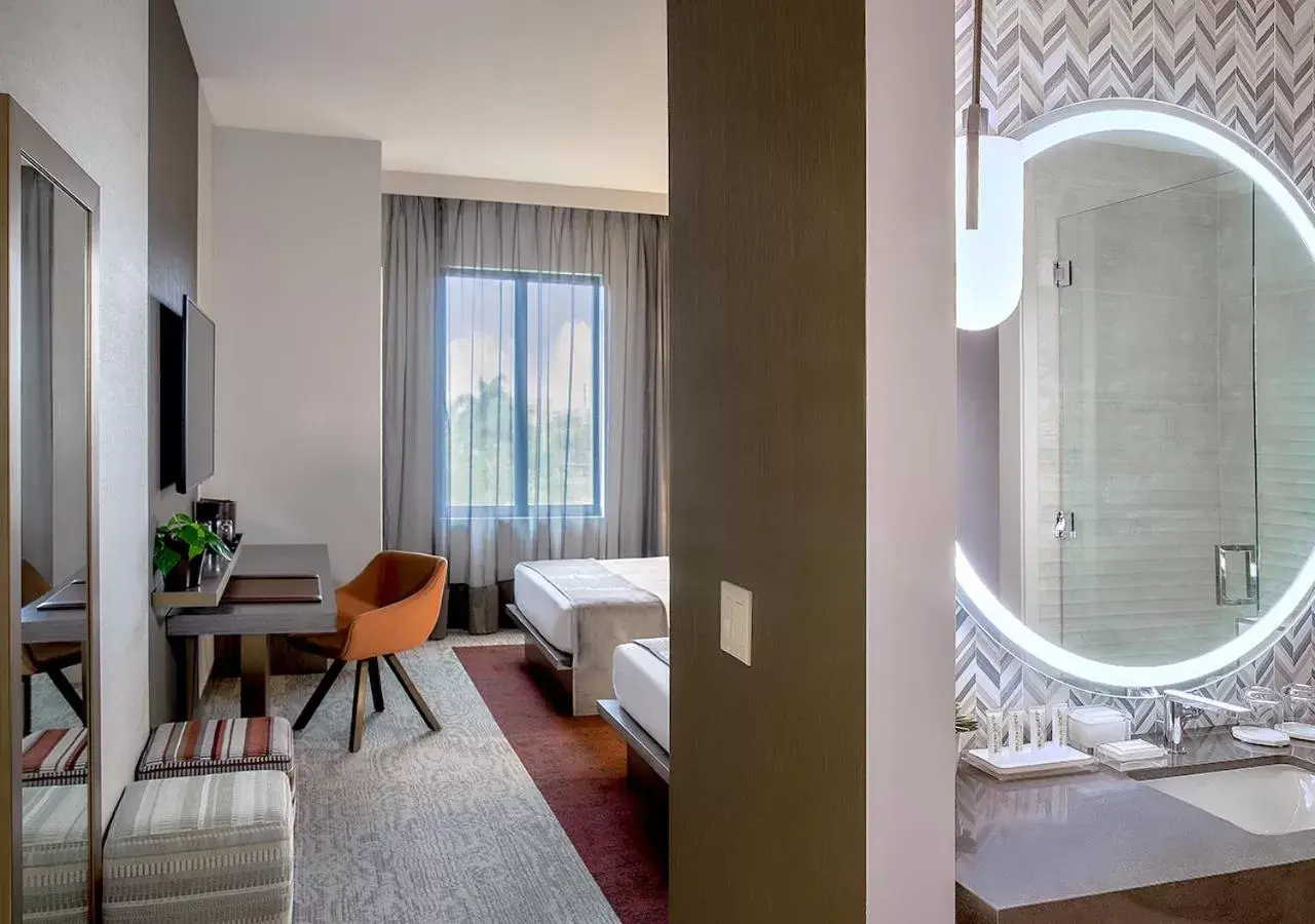 Two Queen Beds Room - Hearing Accessible with Water View in THesis Hotel Miami Coral Gables, Curio Collection by Hilton Two Queen Beds Room - Hearing Accessible with Water View in THesis Hotel Miami Coral Gables, Curio Collection by Hilton