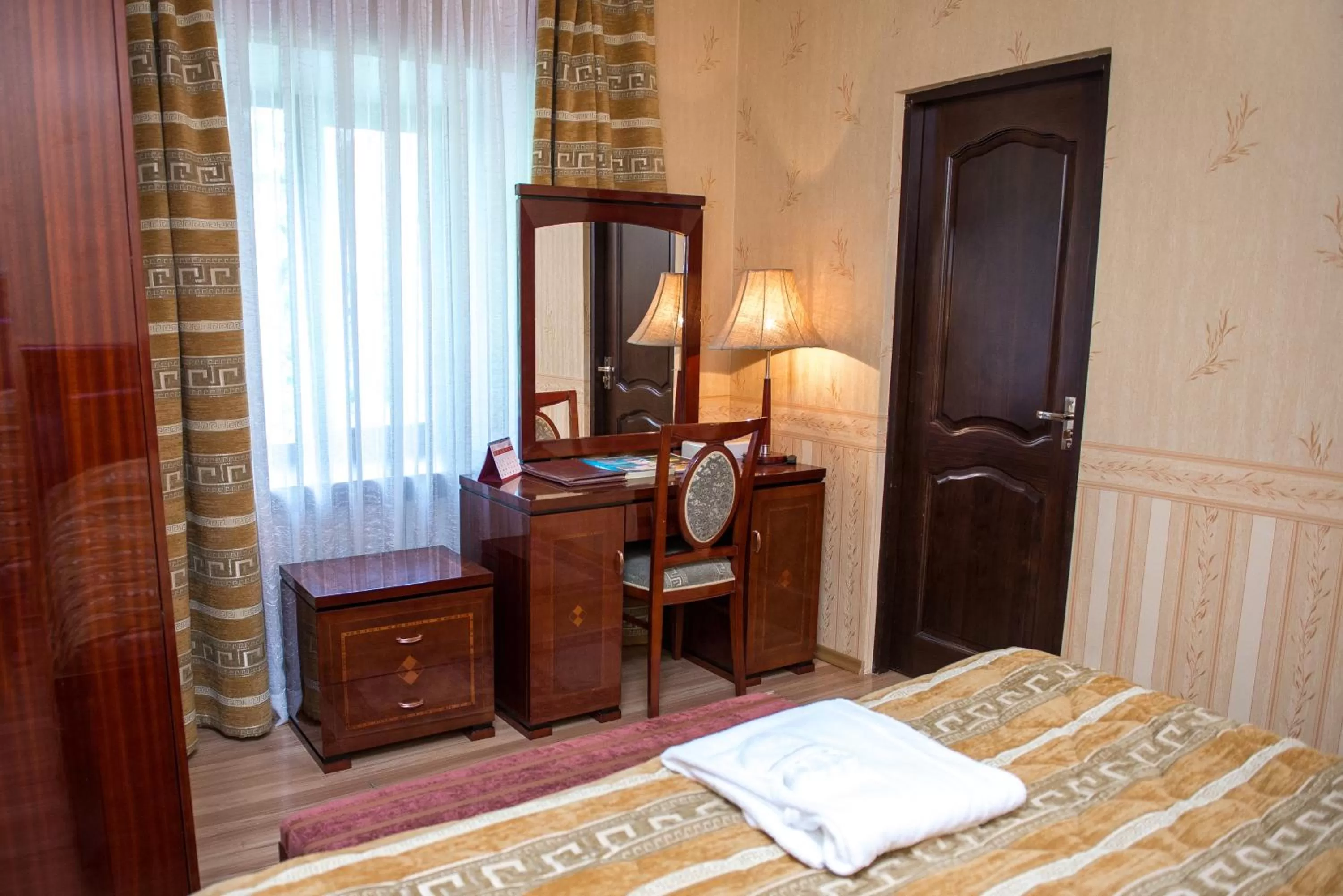 Decorative detail, Bed in Deluxe SPA-Hotel