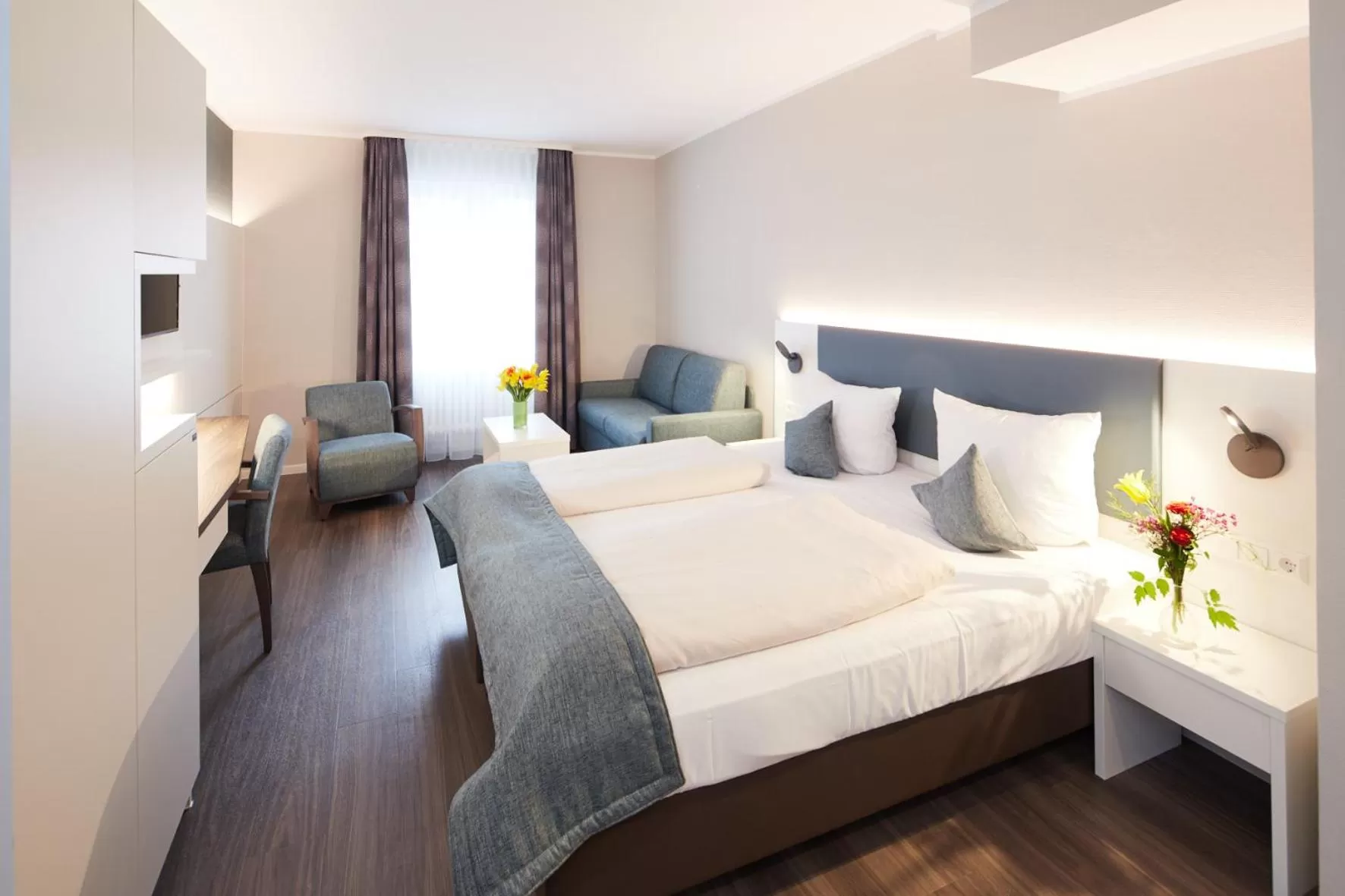 Photo of the whole room, Bed in Stadthotel Freiburg Kolping Hotels & Resorts