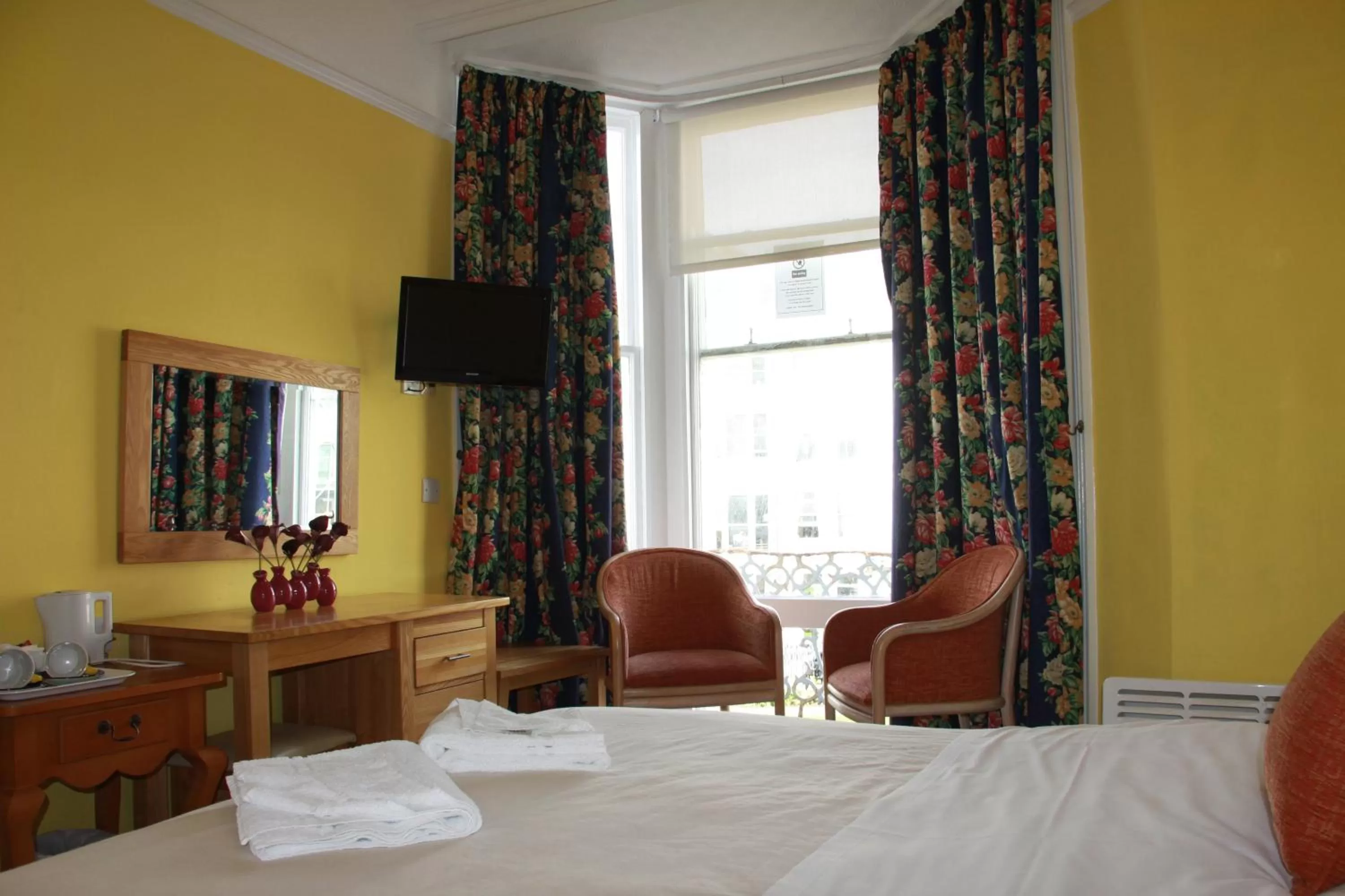 Bed in Ambassador Hotel