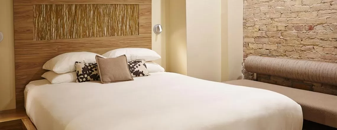 Bed in CityFlatsHotel - Grand Rapids, an Ascend Collection Hotel