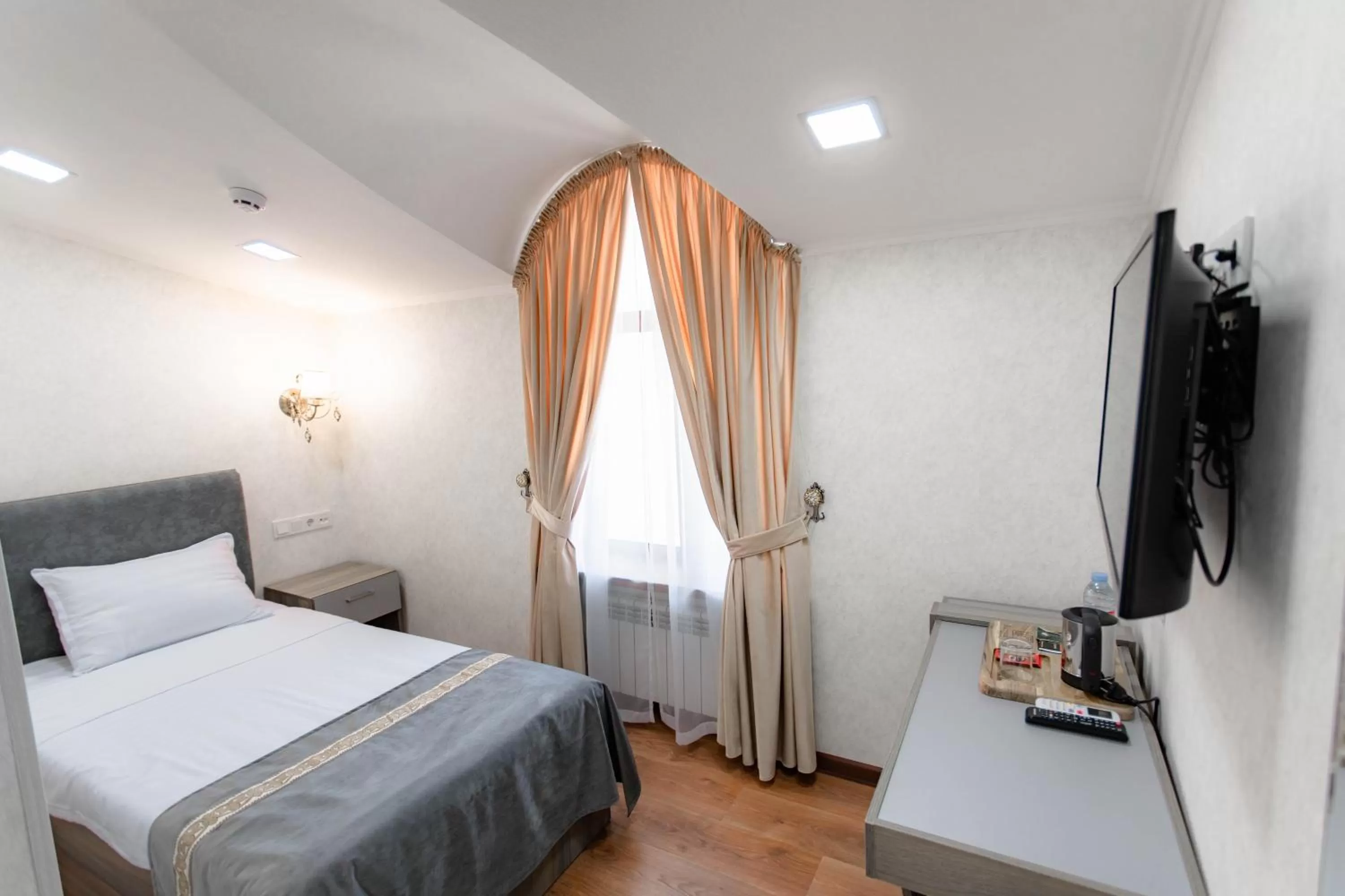 Bed in Registon Saroy Hotel