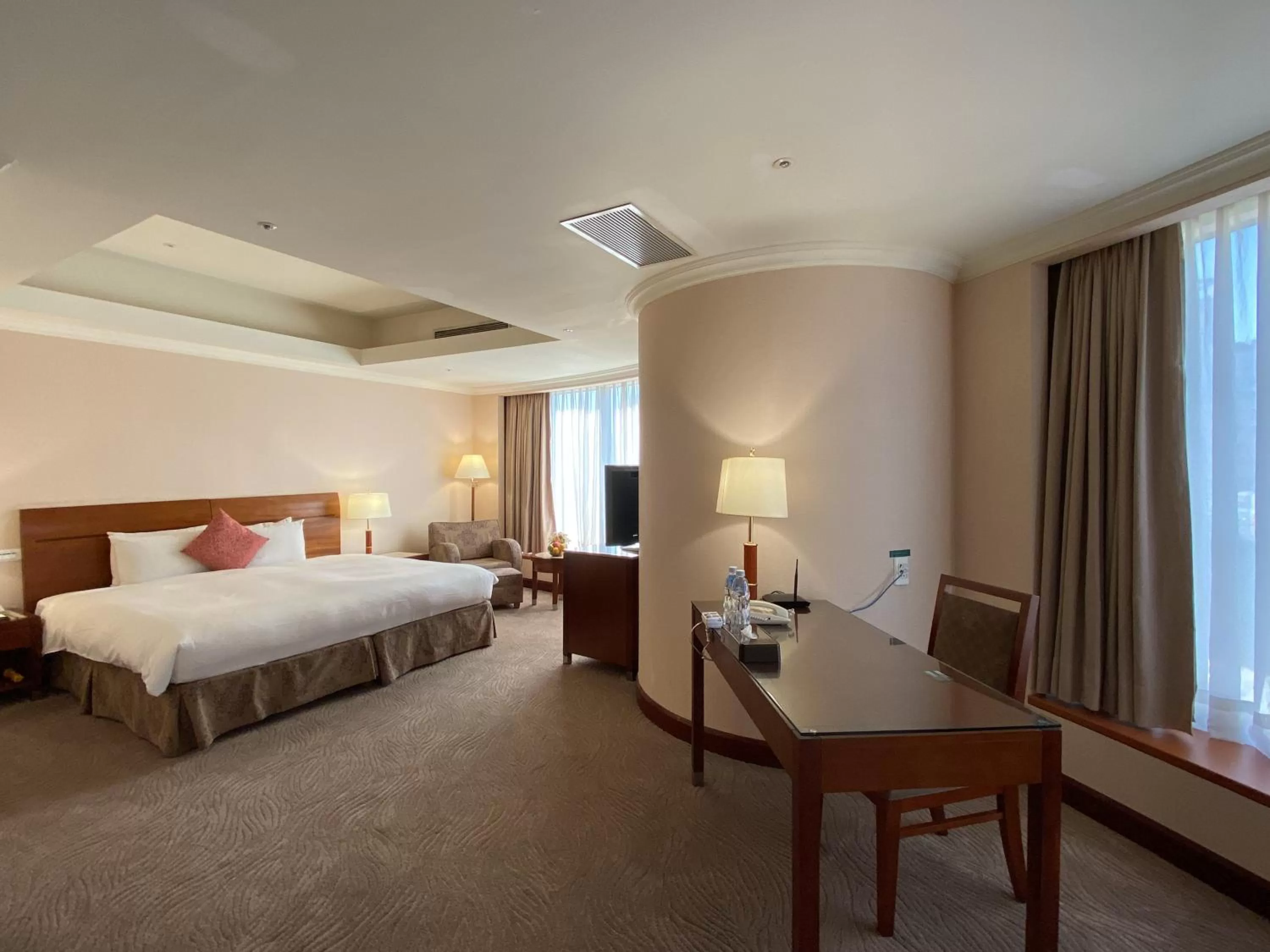 Bed in Monarch Plaza Hotel