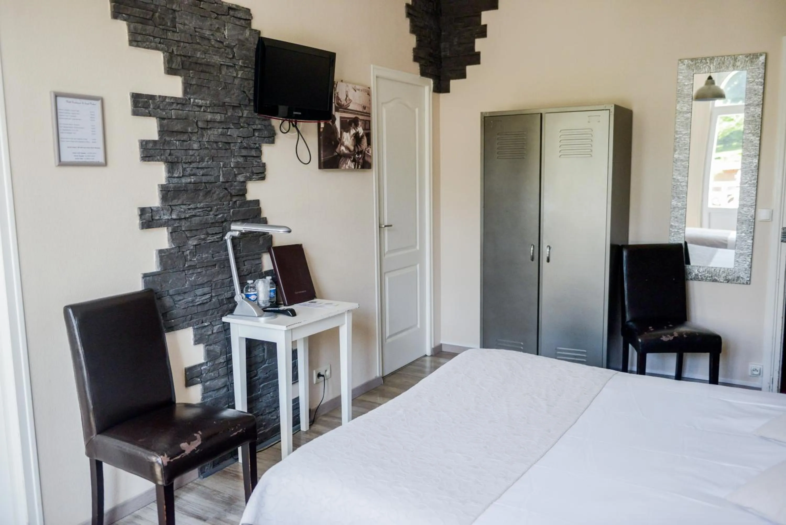 Bed in Logis Le Saint Hubert