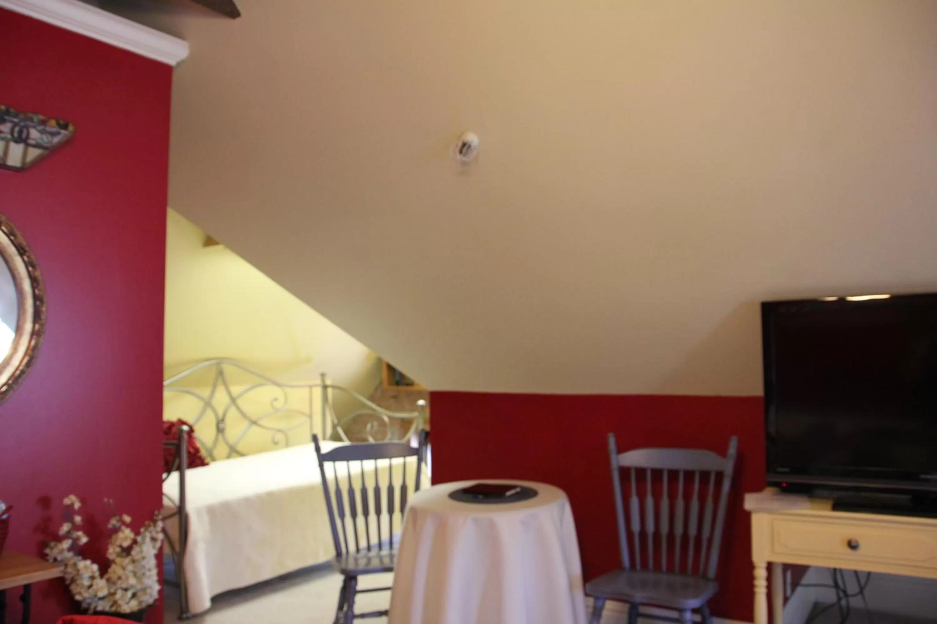 Bed, TV/Entertainment Center in Hines Mansion