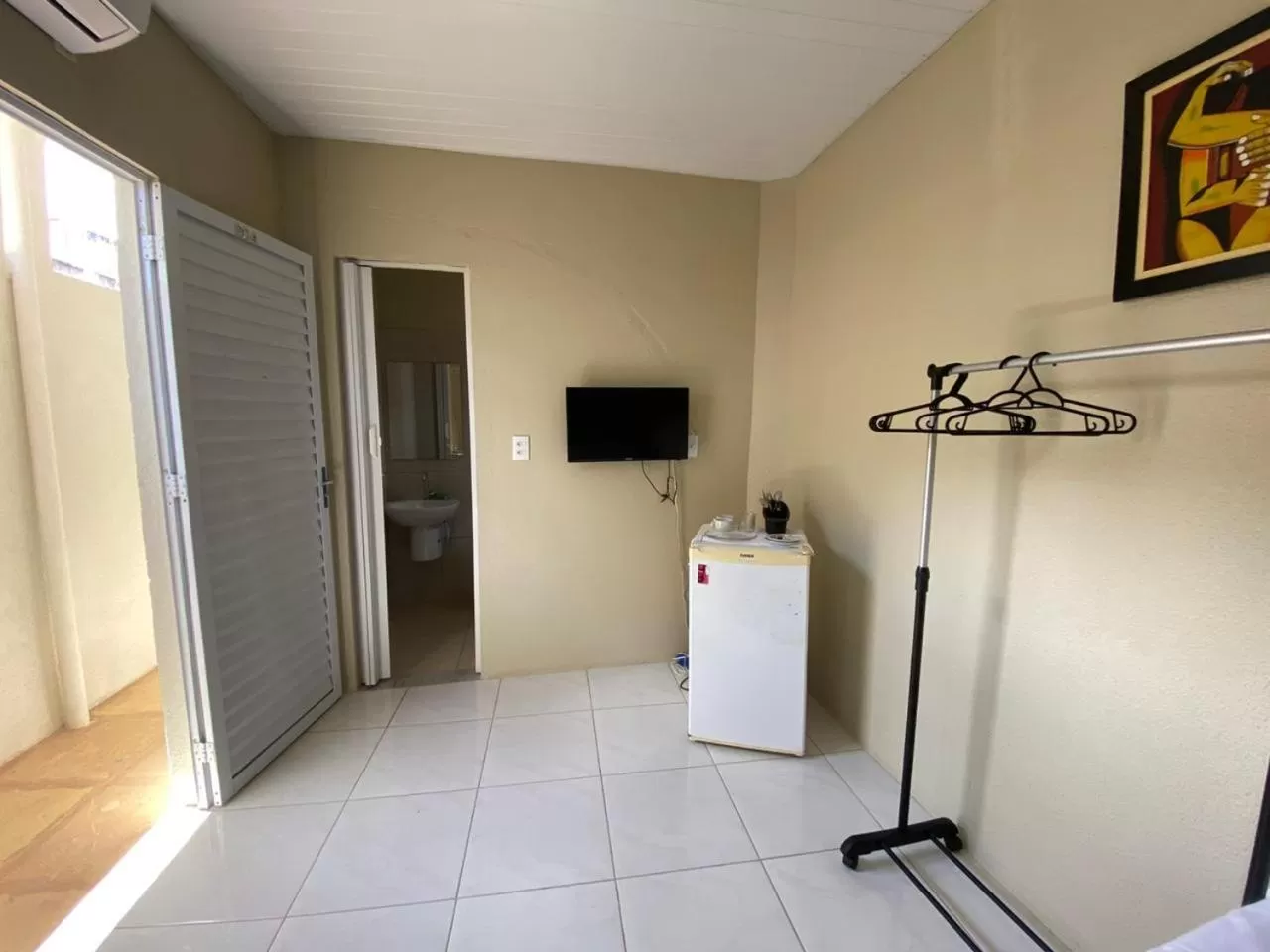 Bedroom, TV/Entertainment Center in Pousada Hostal Iracema