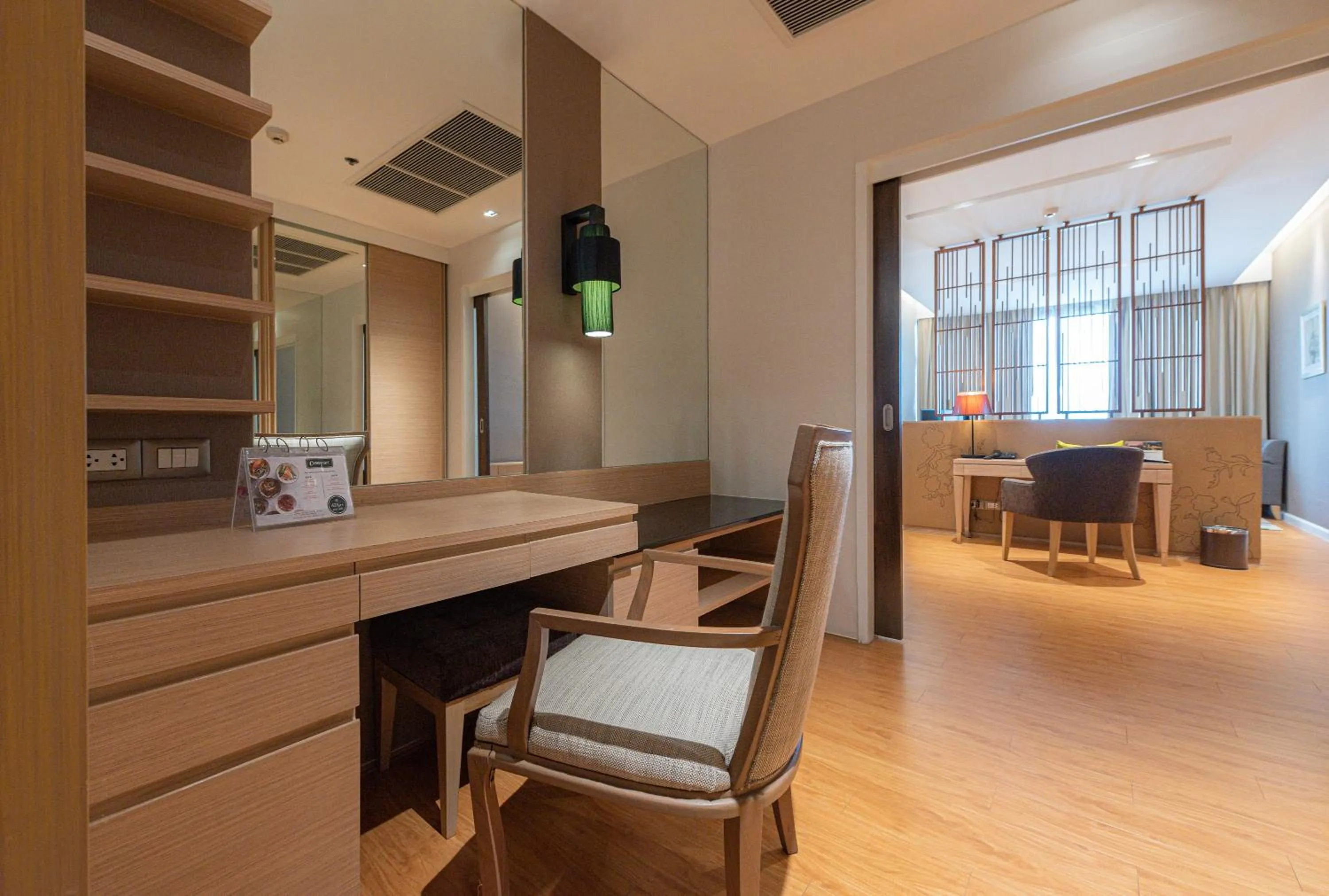 Living room in Summit Windmill Golf Suite Hotel at Suvarnabhumi