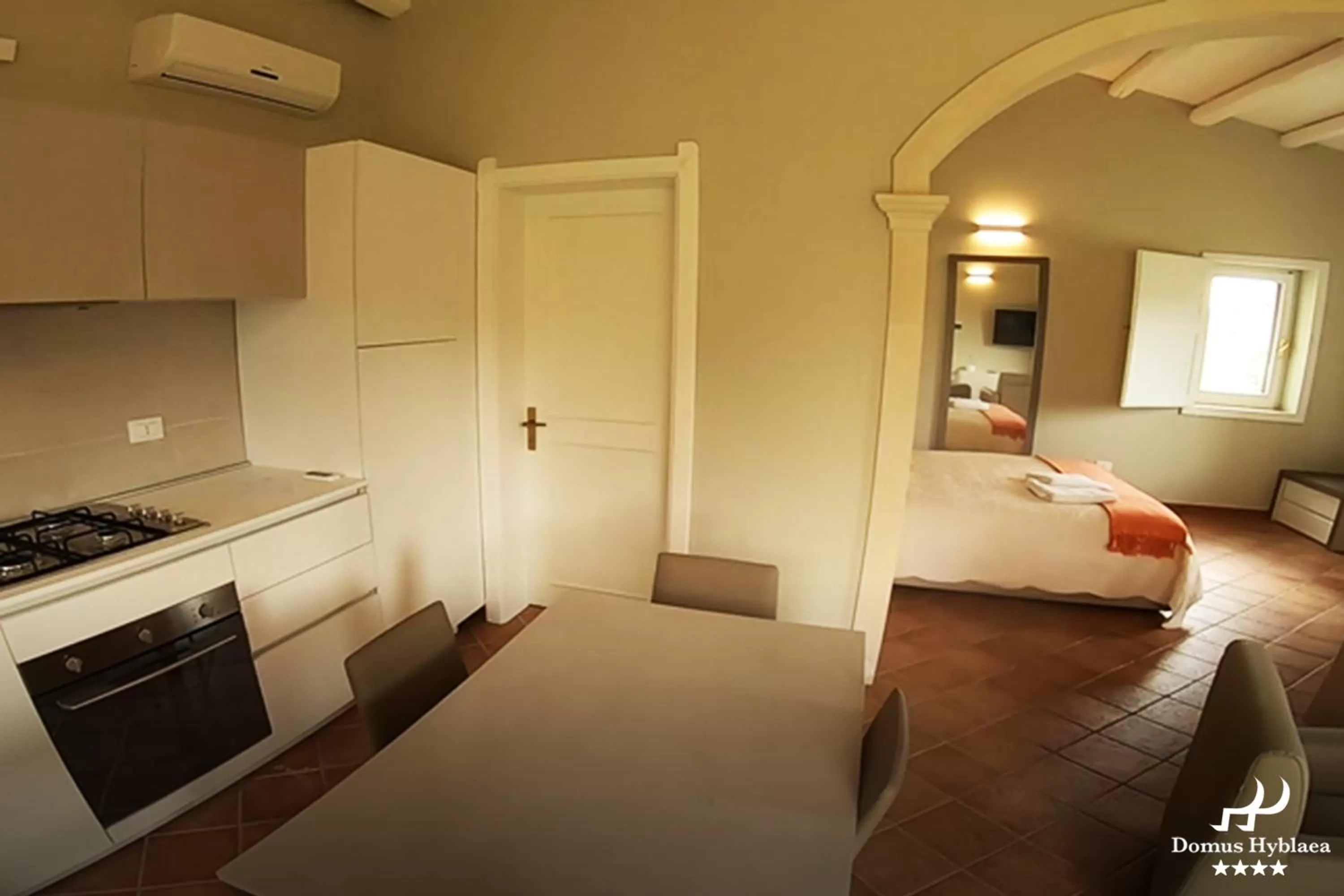 Kitchen or kitchenette, Bed in Domus Hyblaea Resort