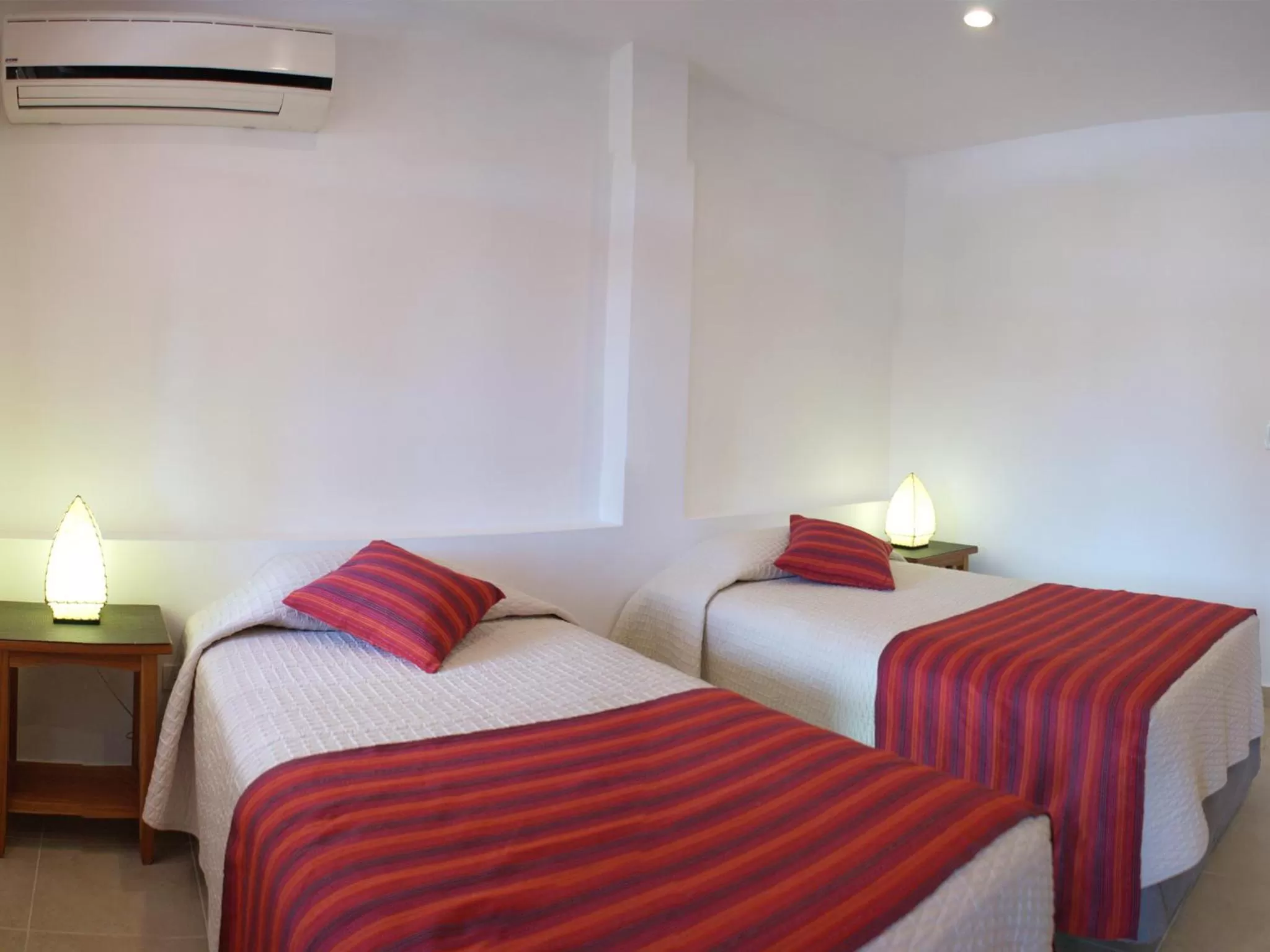 Bed in Hotel Galapagos Suites B&B