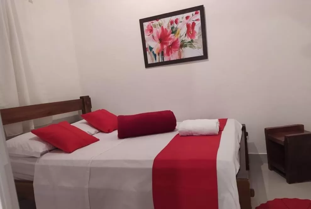 Bed in Pousada Aquarela Pirenopolis