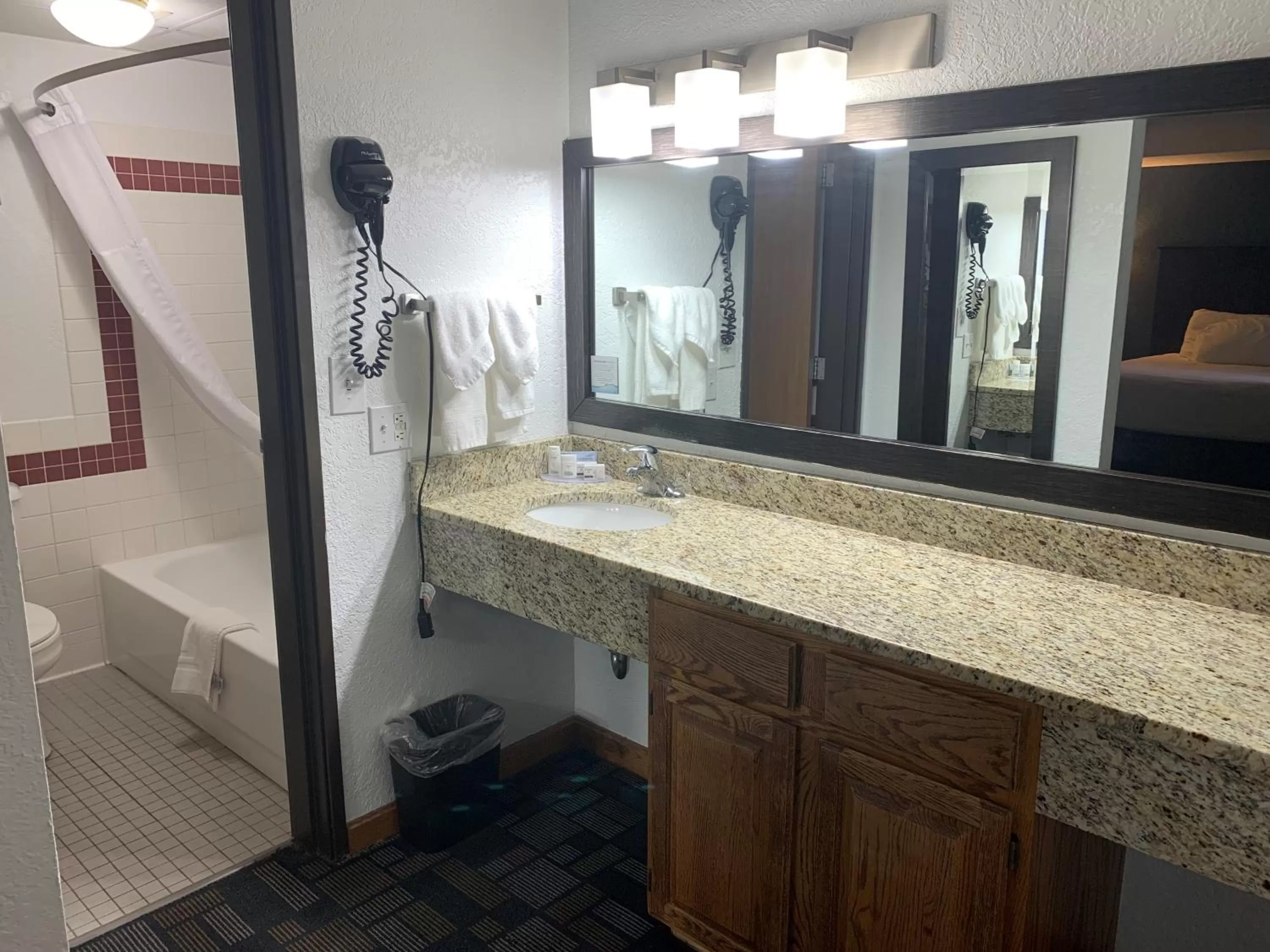 Bathroom in AmericInn by Wyndham Hayward